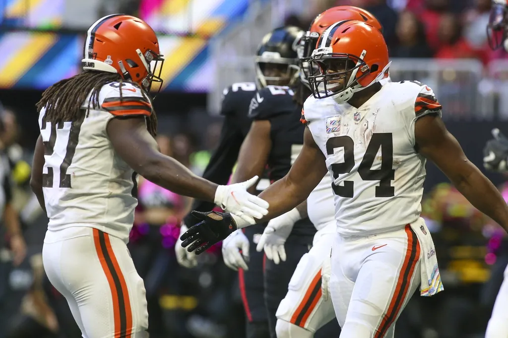 Cleveland Browns running back Nick Chubb (24) celebrates after a touchdown with running back Kareem Hunt (27) against the Atlanta Falcons in the second half at Mercedes-Benz Stadium.