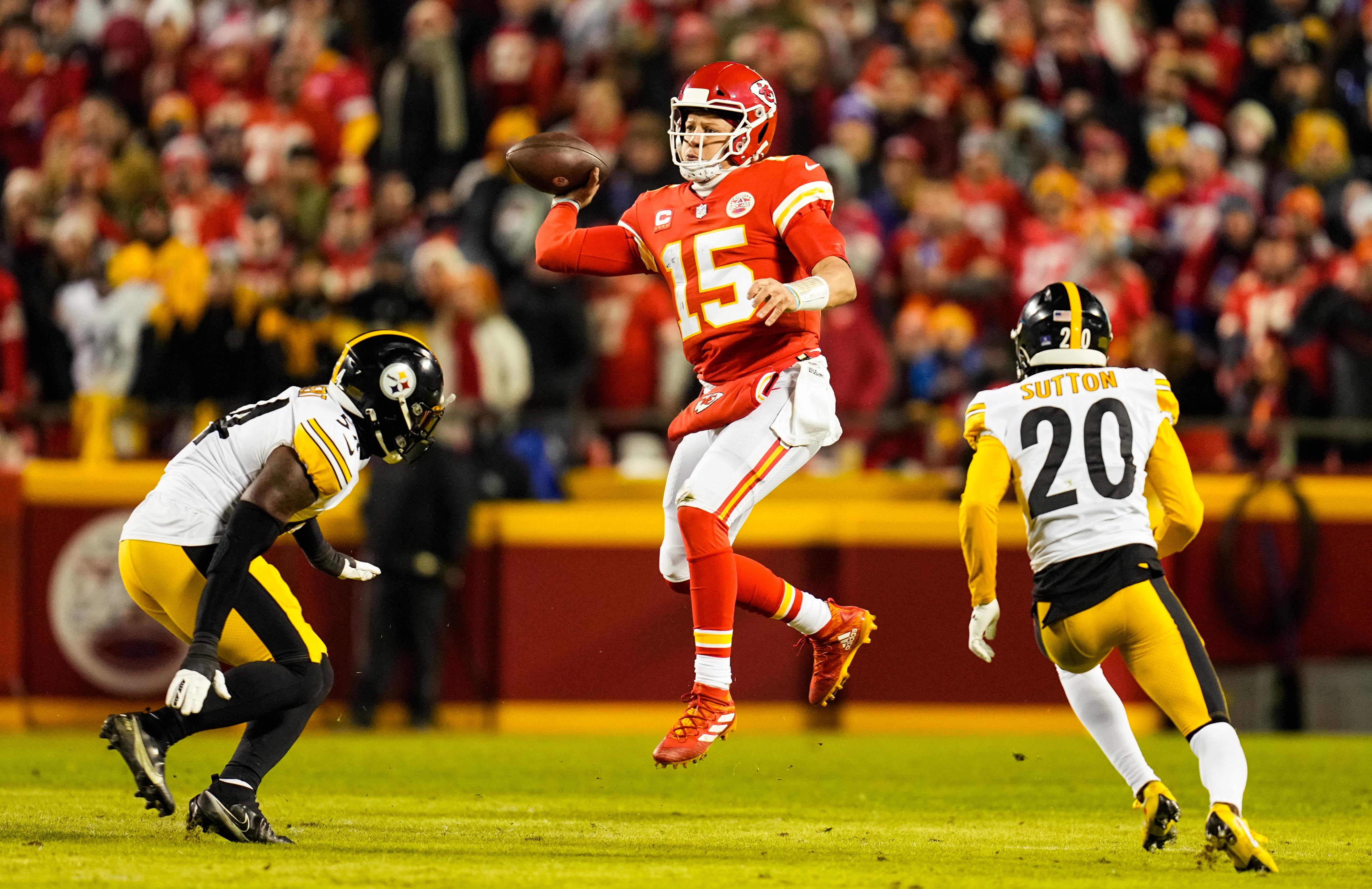 Jan 16, 2022; Kansas City, Missouri, USA; Kansas City Chiefs quarterback Patrick Mahomes (15) throws a pass as Pittsburgh Steelers linebacker Ulysees Gilbert (54) and cornerback Cameron Sutton (20) during the first half in an AFC Wild Card playoff football game at GEHA Field at Arrowhead Stadium.