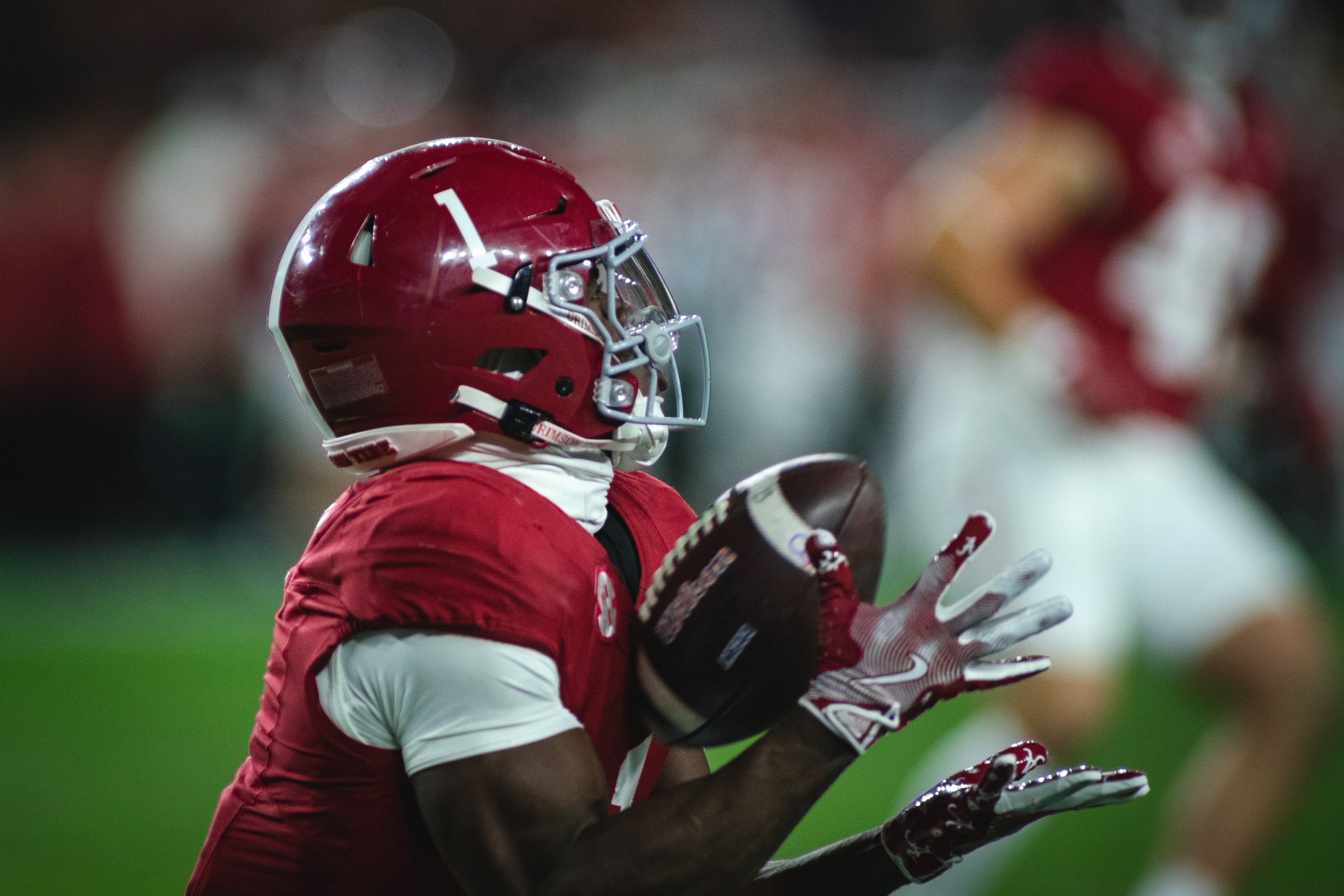 Alabama Crimson Tide wide receiver Kendrick Law (1) receives the ball against the Auburn Tigers during the third quarter at Bryant-Denny Stadium.