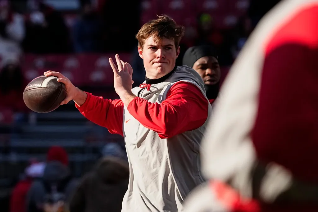 Ohio State Buckeyes quarterback Will Howard (18) warms up prior to the NCAA football game against the Michigan Wolverines at Ohio Stadium in Columbus on Tuesday, Dec. 3, 2024. Michigan won 13-10