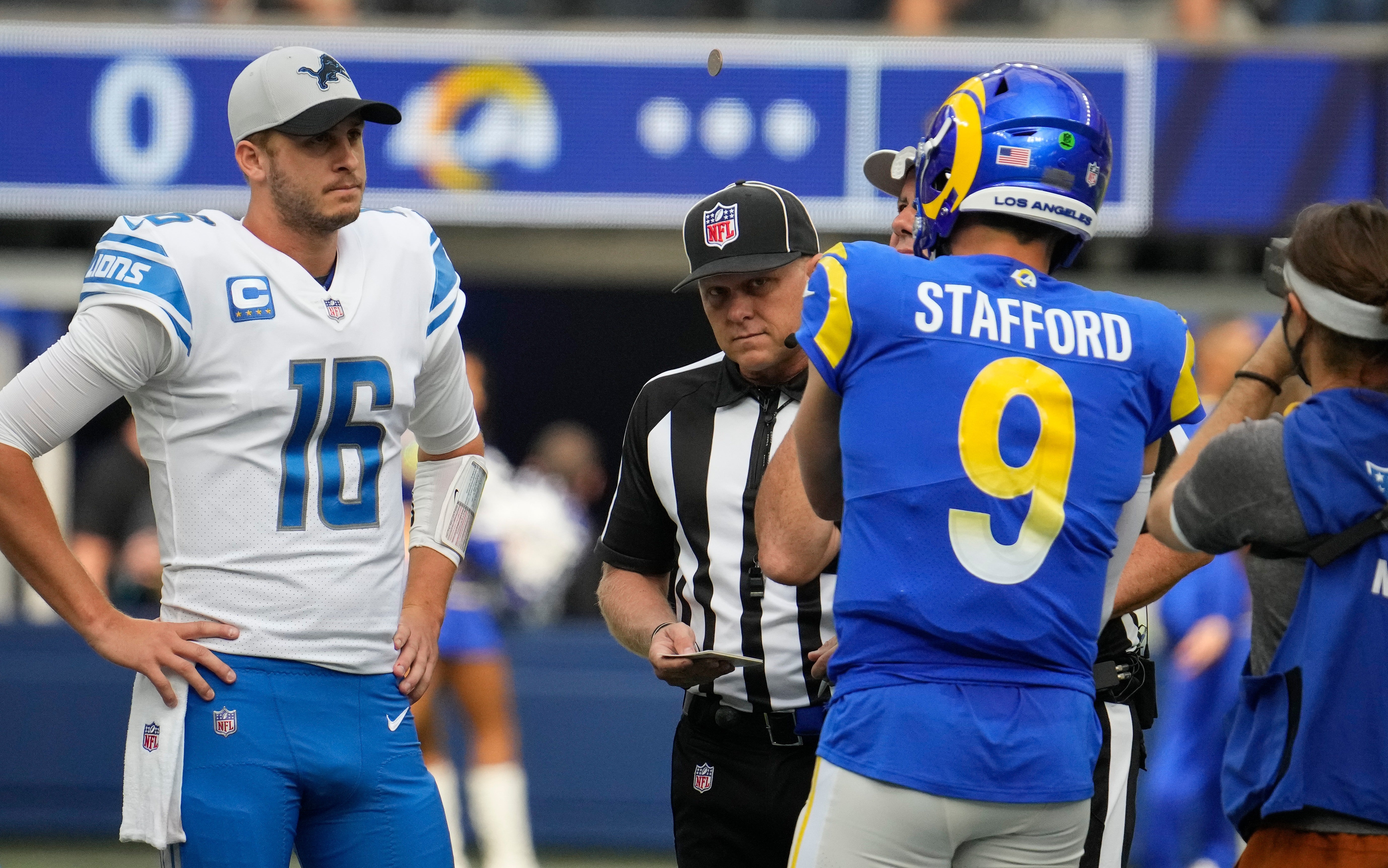 Oct 24, 2021; Inglewood, California, USA; Detroit Lions quarterback Jared Goff (16) and Los Angeles Rams quarterback Matthew Stafford (9) during the coin flip before the start of the Rams-Lions game at SoFi Stadium.