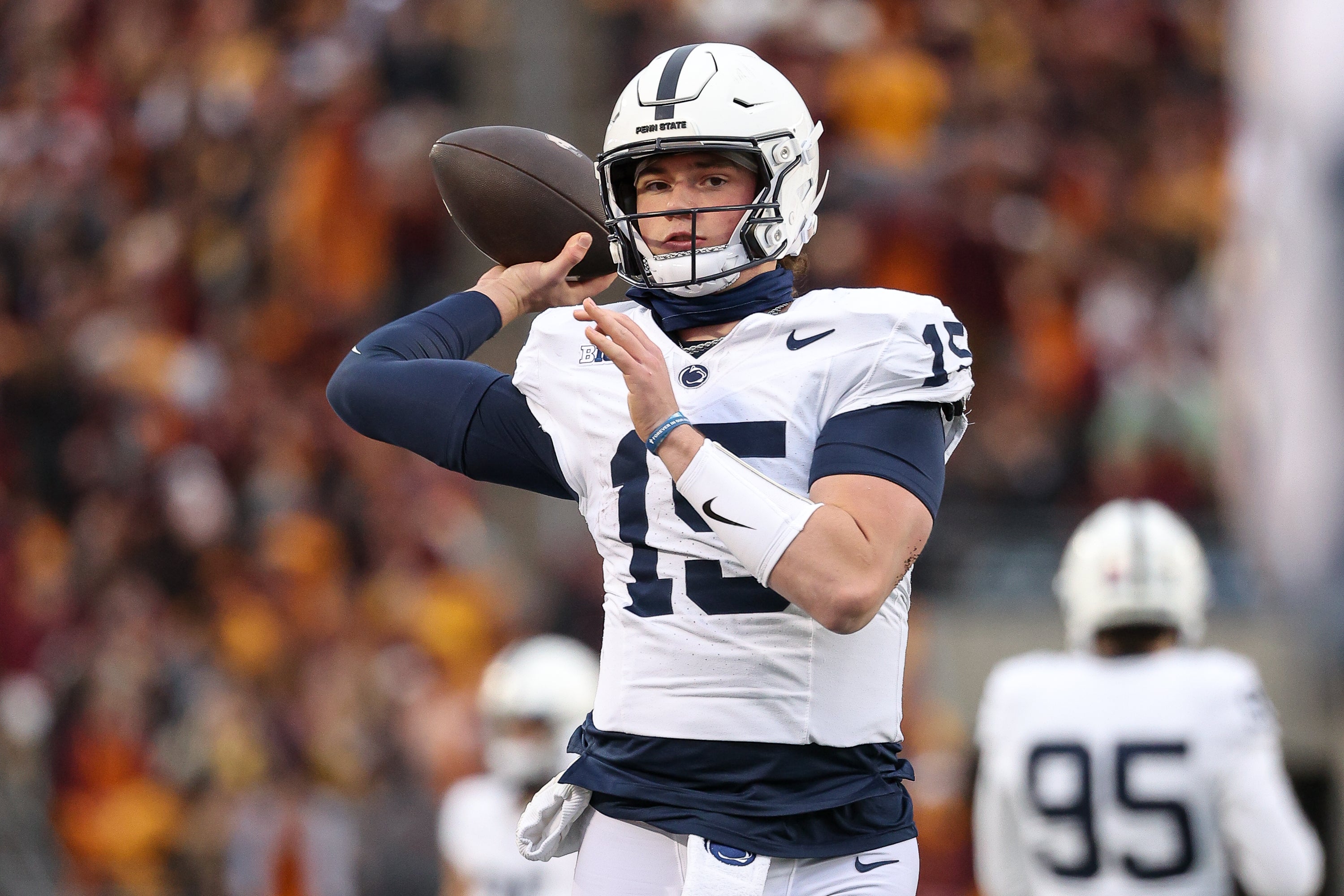 Nov 23, 2024; Minneapolis, Minnesota, USA; Penn State Nittany Lions quarterback Drew Allar (15) throws during a T.V. timeout during the second quarter against the Minnesota Golden Gophers at Huntington Bank Stadium.