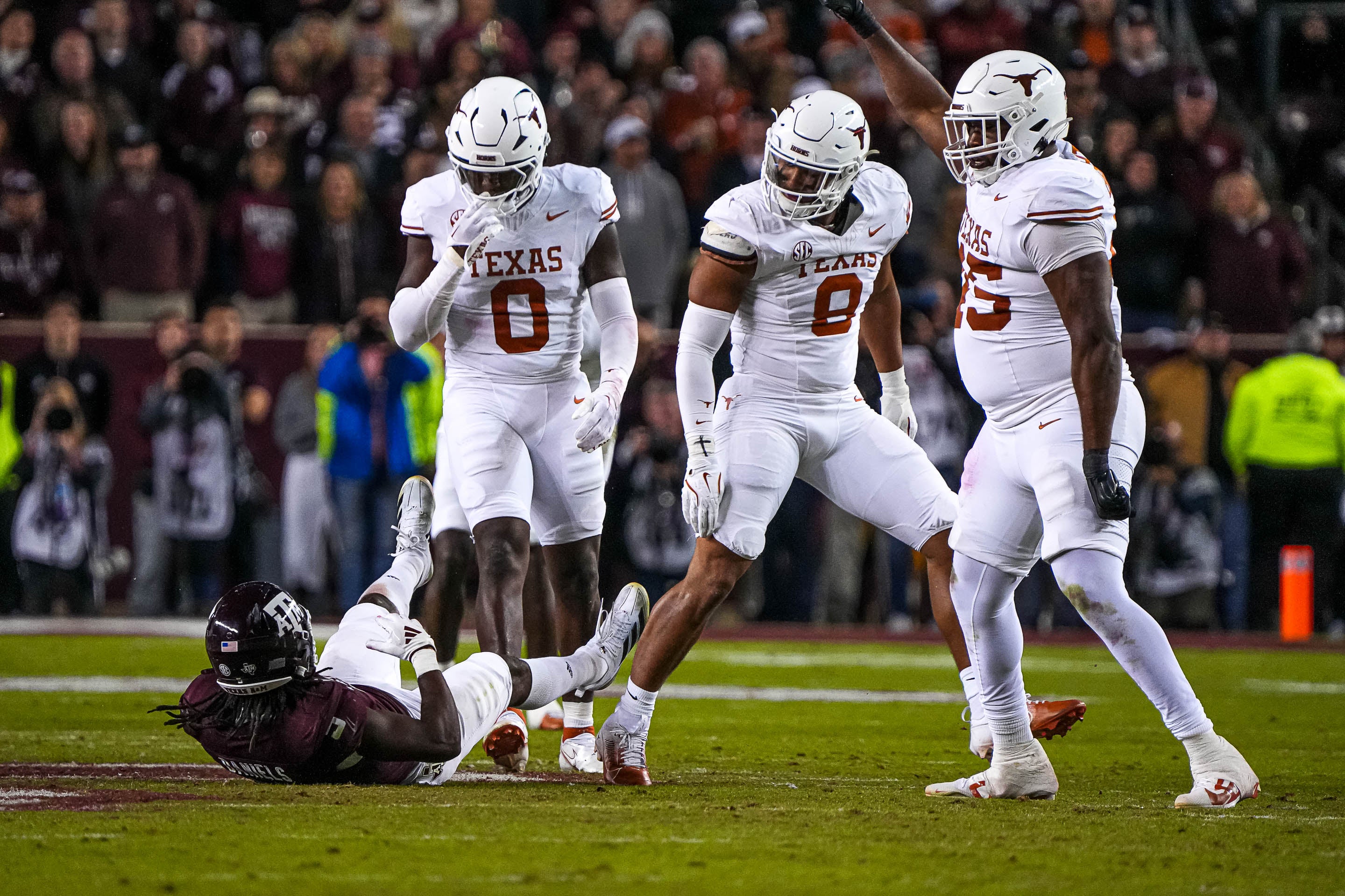 Texas Longhorns linebacker Anthony Hill Jr. (0) looks down at Texas A&M running back Amari Daniels (5) after a tackle during the Lone Star Showdown at Kyle Field.