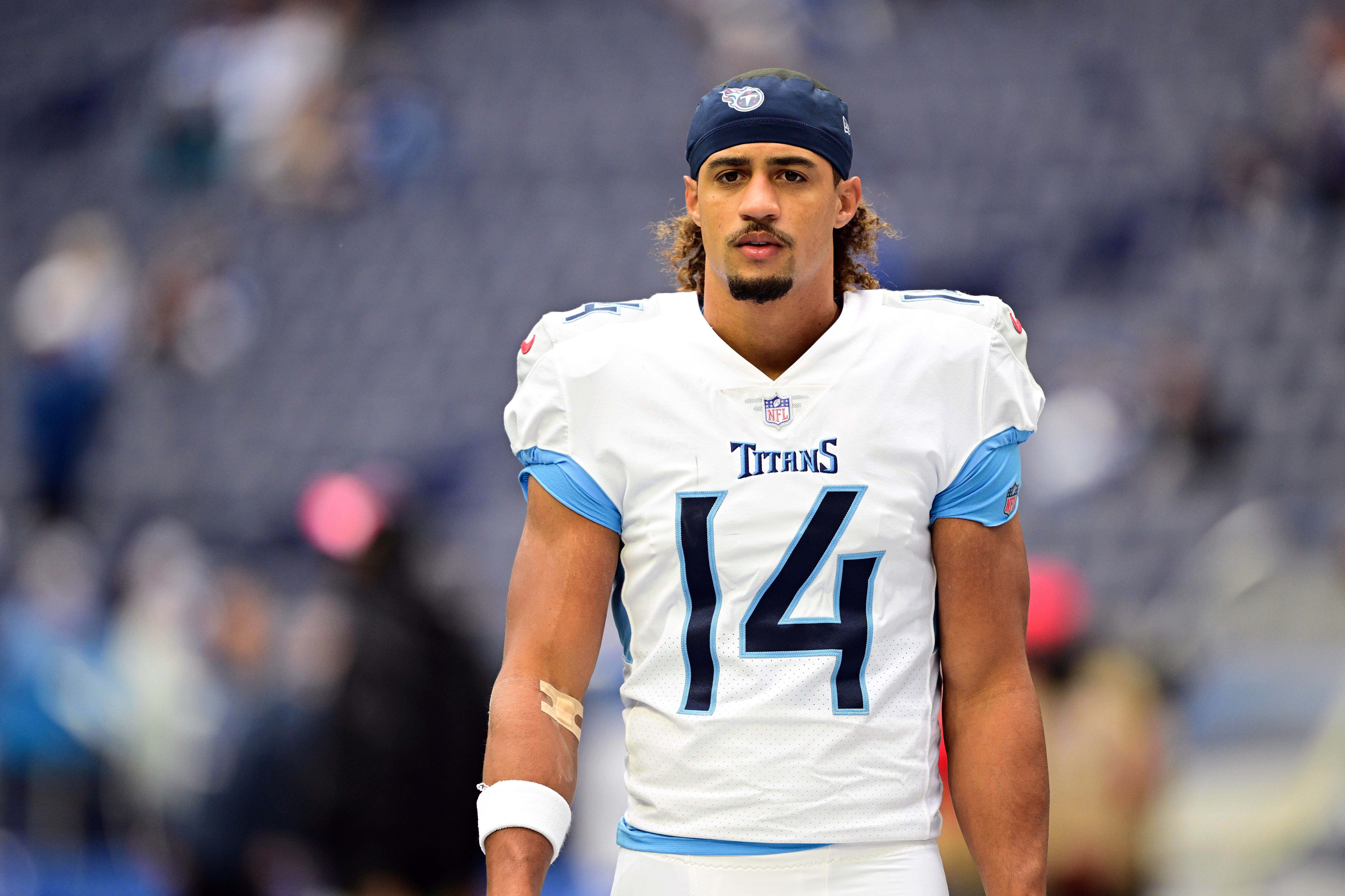 Tennessee Titans wide receiver Colton Dowell (14) walks onto the field for warmups before the game against the Indianapolis Colts at Lucas Oil Stadium. Marc Lebryk-Imagn Images