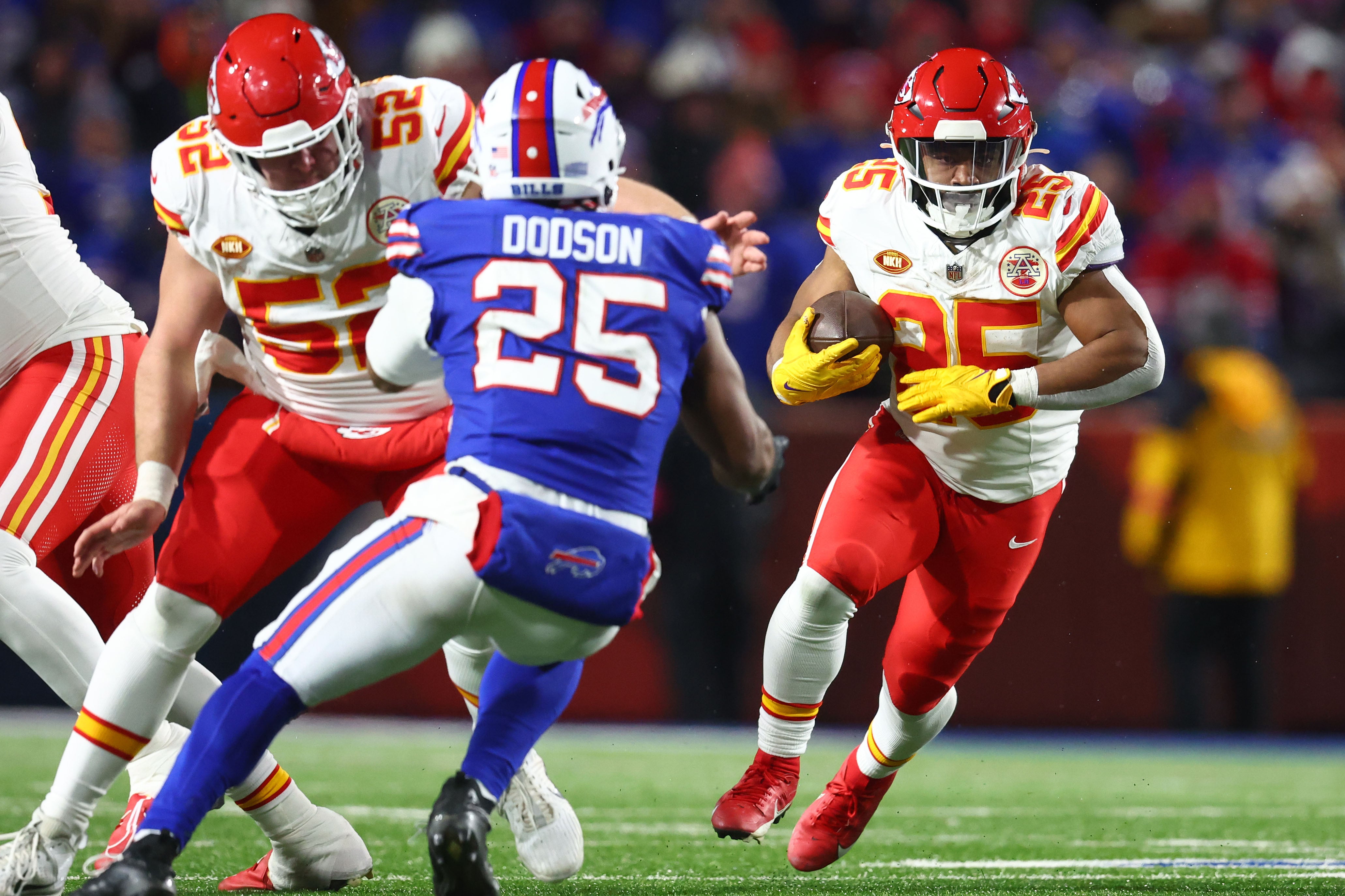 Jan 21, 2024; Orchard Park, New York, USA; Kansas City Chiefs running back Clyde Edwards-Helaire (25) rushes the ball against Buffalo Bills linebacker Tyrel Dodson (25) during the second half for the 2024 AFC divisional round game at Highmark Stadium.