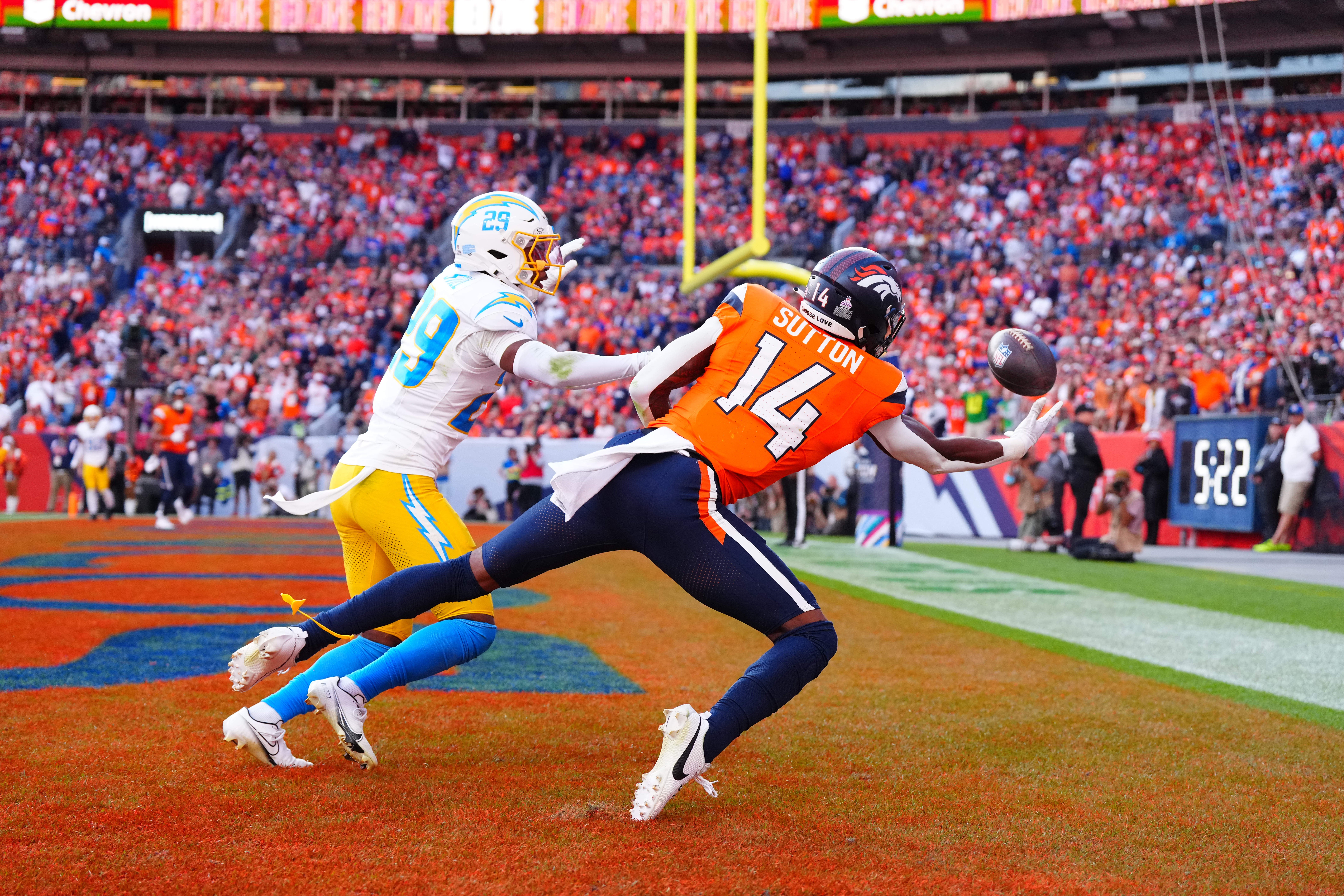 Broncos wide receiver Courtland Sutton (14) pulls in a touchdown pass over Chargers cornerback Tarheeb Still