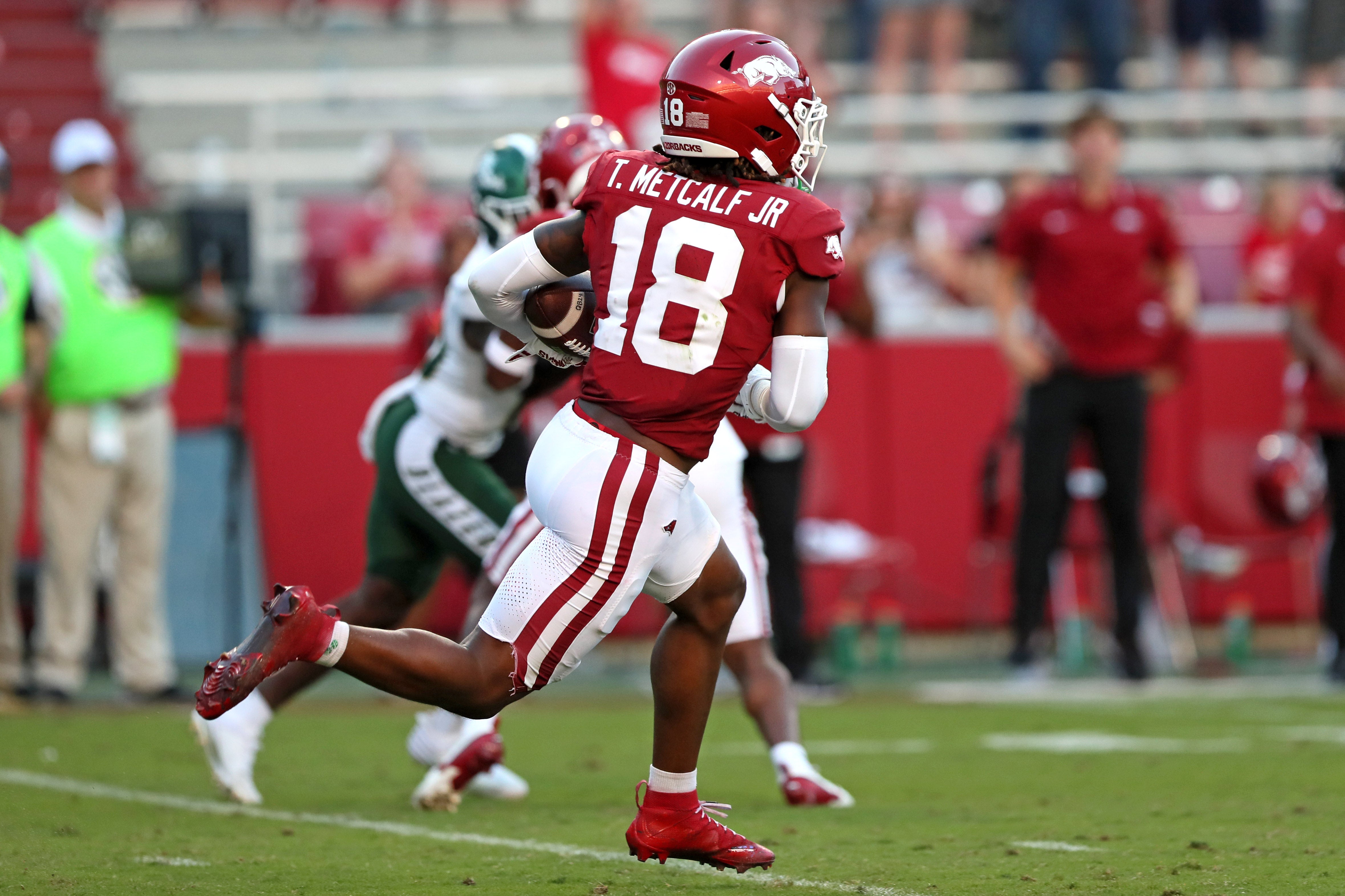 Sep 14, 2024; Fayetteville, Arkansas, USA; Arkansas Razorbacks defensive back TJ Metcalf Jr (18) runs after an interception in the fourth quarter against the UAB Blazers at Donald W. Reynolds Razorback Stadium. Arkansas won 37-27