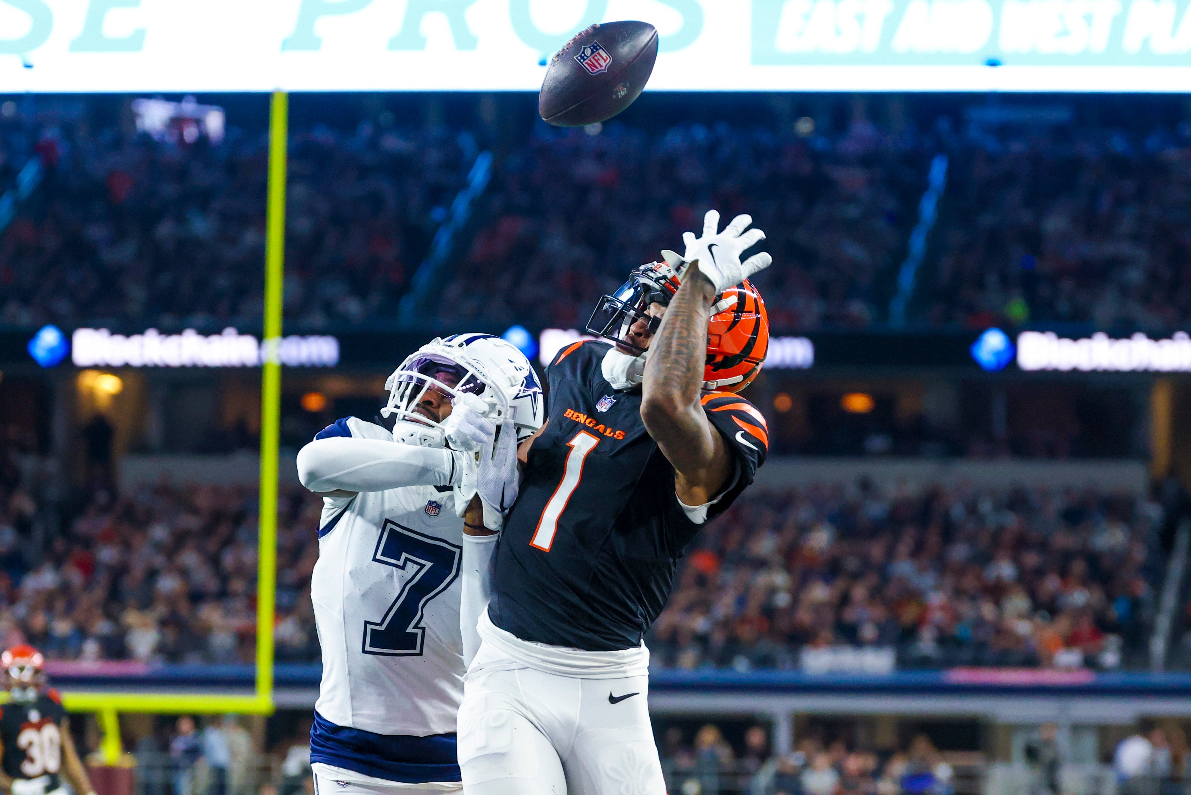 Dallas Cowboys cornerback Trevon Diggs (7) defends a pass intended for Cincinnati Bengals wide receiver Ja'Marr Chase (1) during the first half at AT&T Stadium.