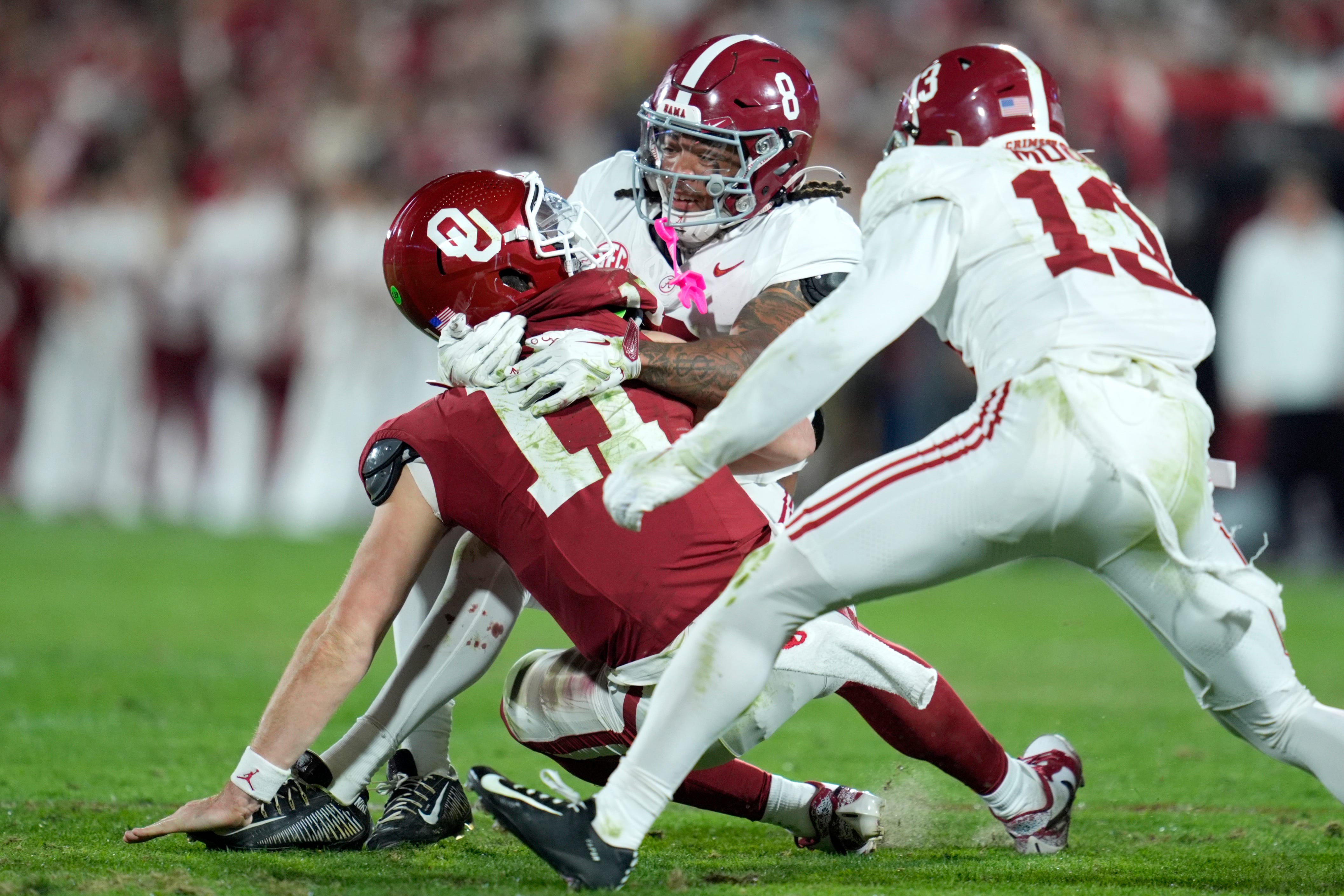 Alabama Crimson Tide defensive back DeVonta Smith (8) brings down /s110/ during a college football game between the University of Oklahoma Sooners (OU) and the Alabama Crimson Tide at Gaylord Family - Oklahoma Memorial Stadium in Norman, Okla., Saturday, Nov. 23, 2024.