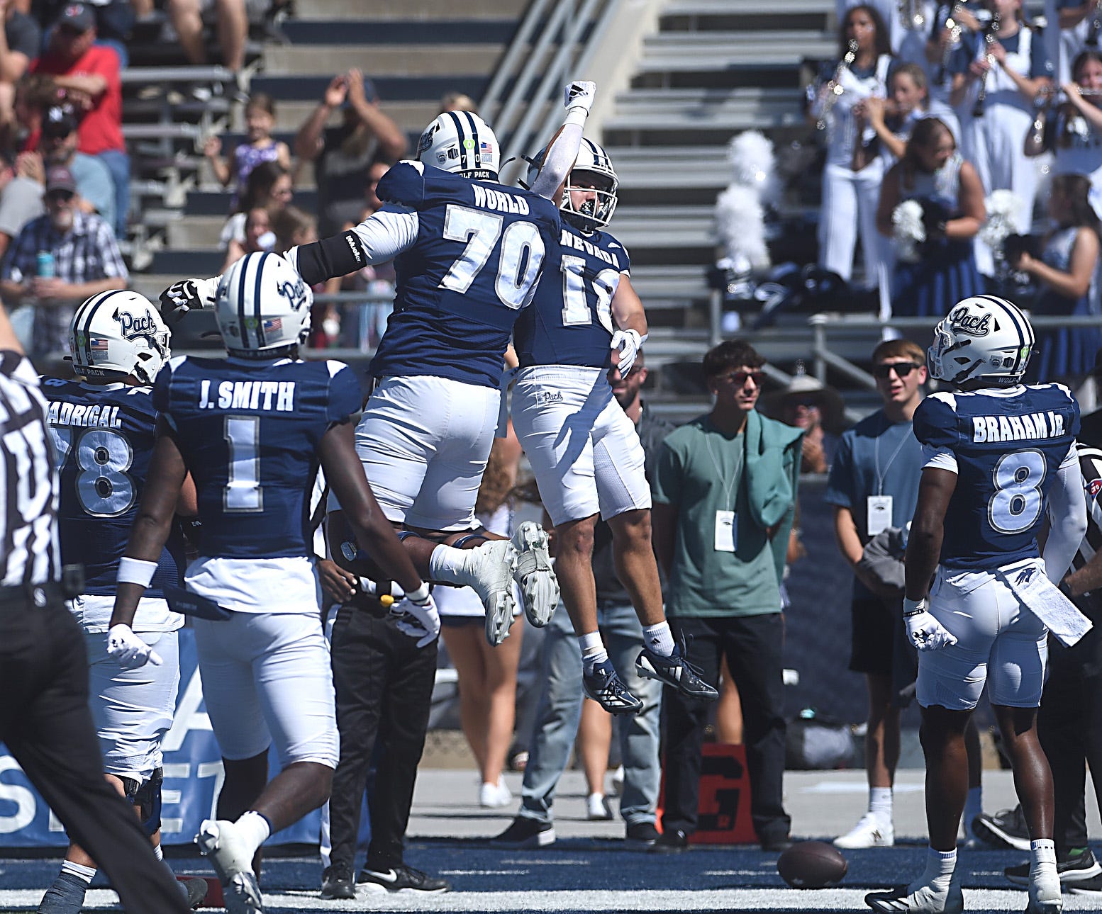 Nevada’s Marcus Bellon (18) and Isaiah World celebrate a touchdown while taking on Eastern Washington during their football game at Mackay Stadium in Reno on Sept. 21, 2024.