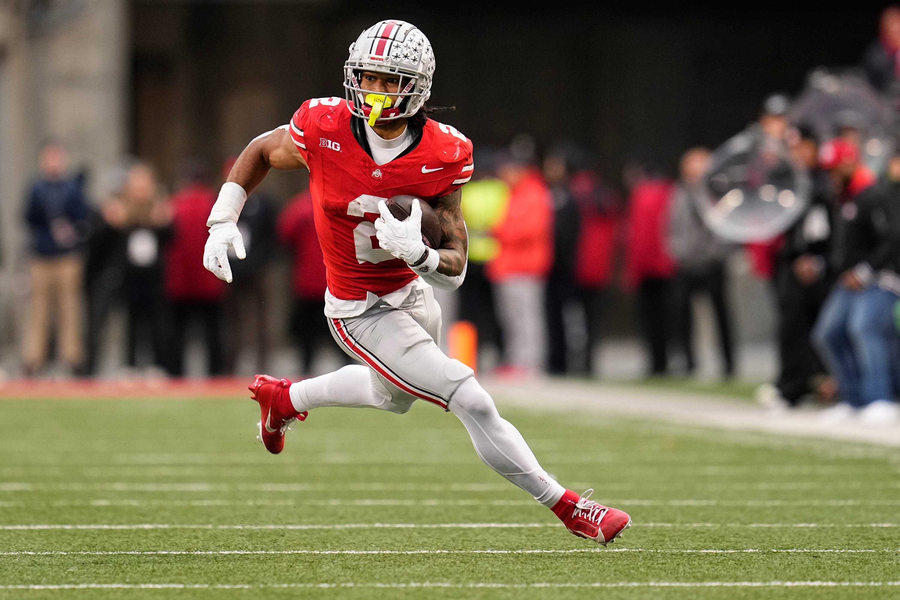 Ohio State Buckeyes wide receiver Emeka Egbuka (2) runs after making a catch during the NCAA football game against the Indiana Hoosiers at Ohio Stadium in Columbus on Monday, Nov. 25, 2024. Ohio State won 38-15.