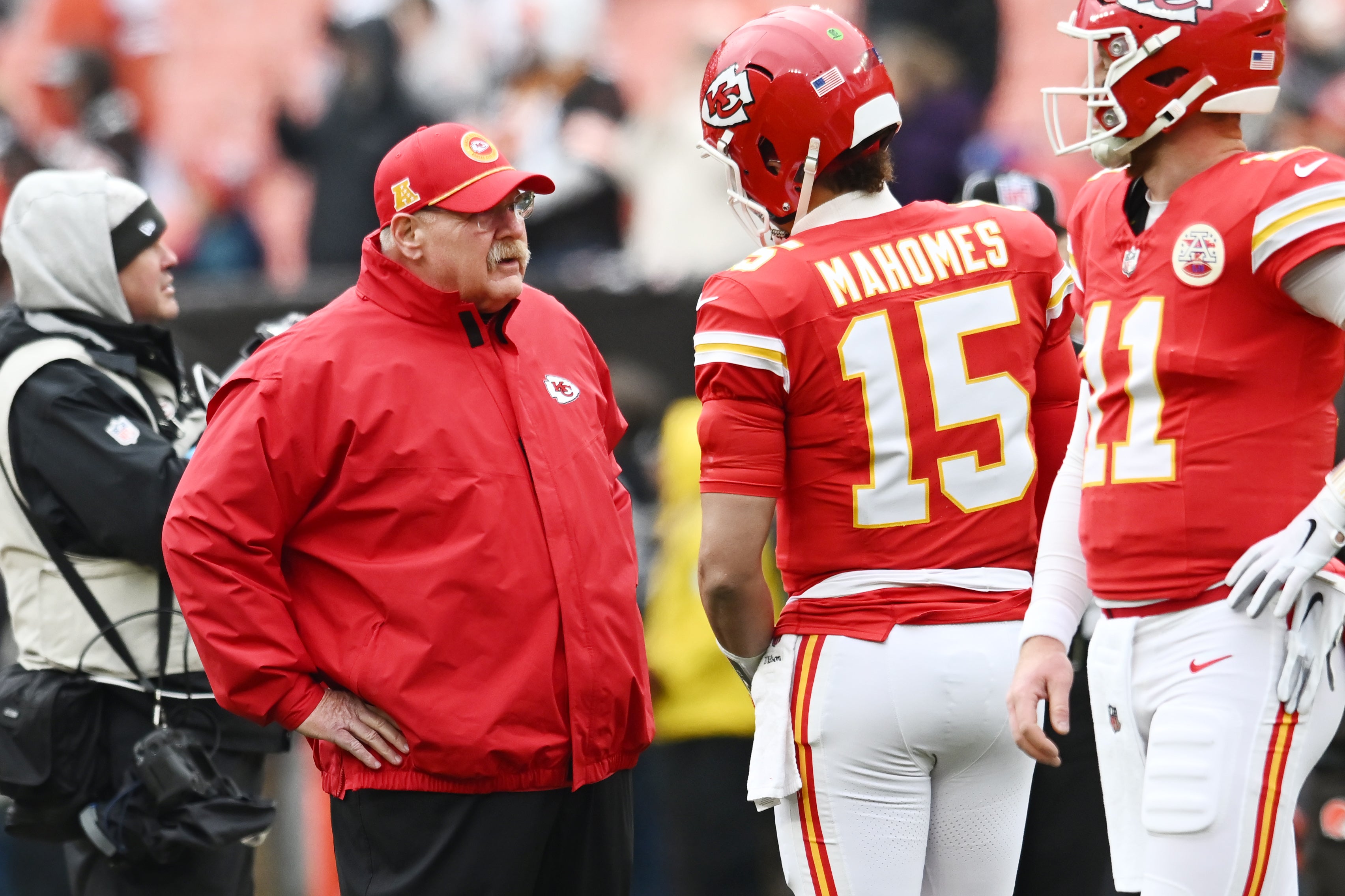 Dec 15, 2024; Cleveland, Ohio, USA; Kansas City Chiefs head coach Andy Reid talks to quarterback Patrick Mahomes (15) before the game between the Cleveland Browns and the Chiefs at Huntington Bank Field.