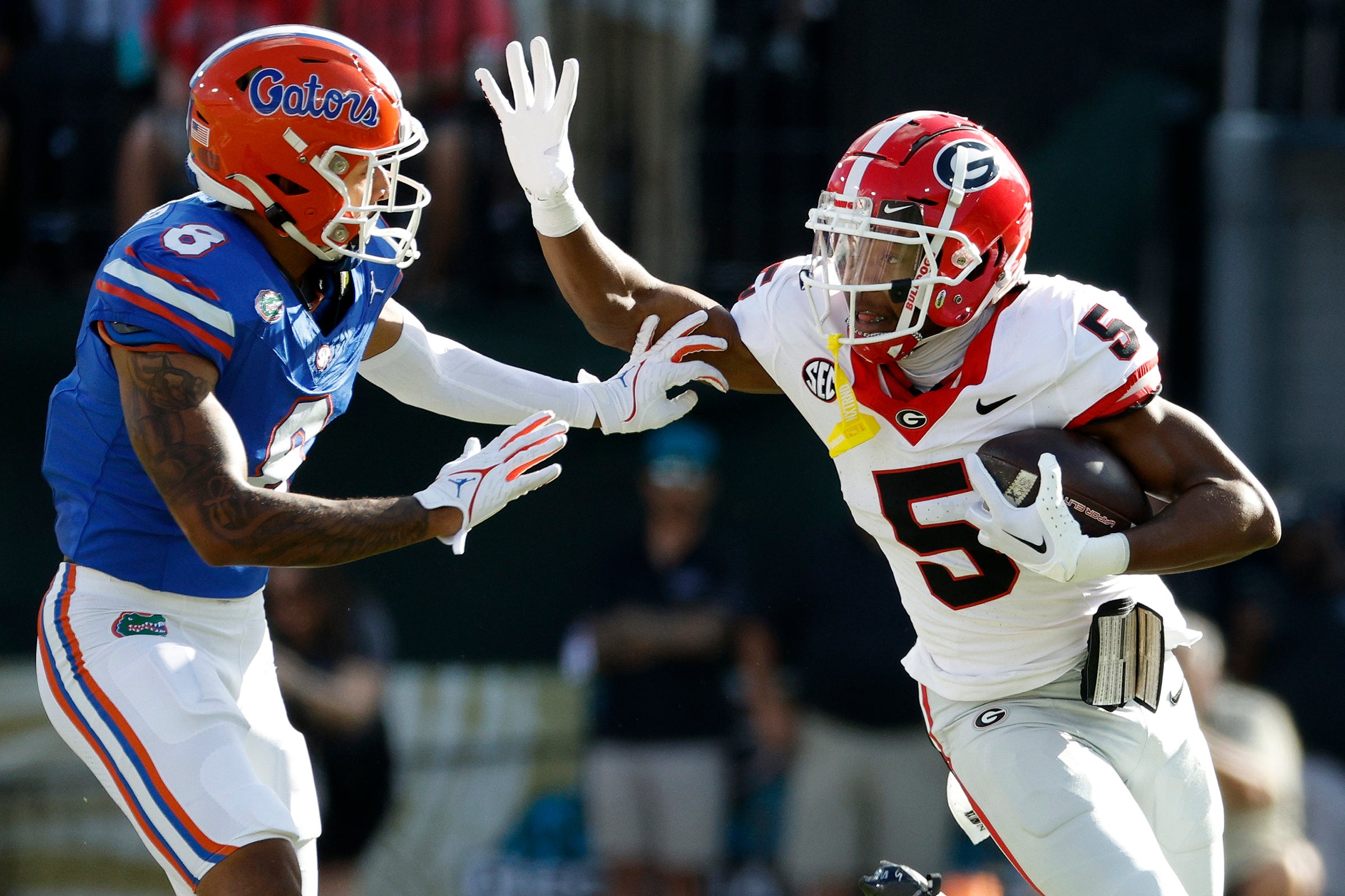 Georgia Bulldogs wide receiver Rara Thomas (5) runs against Florida Gators cornerback Jalen Kimber (8) in the first half at EverBank Stadium.
