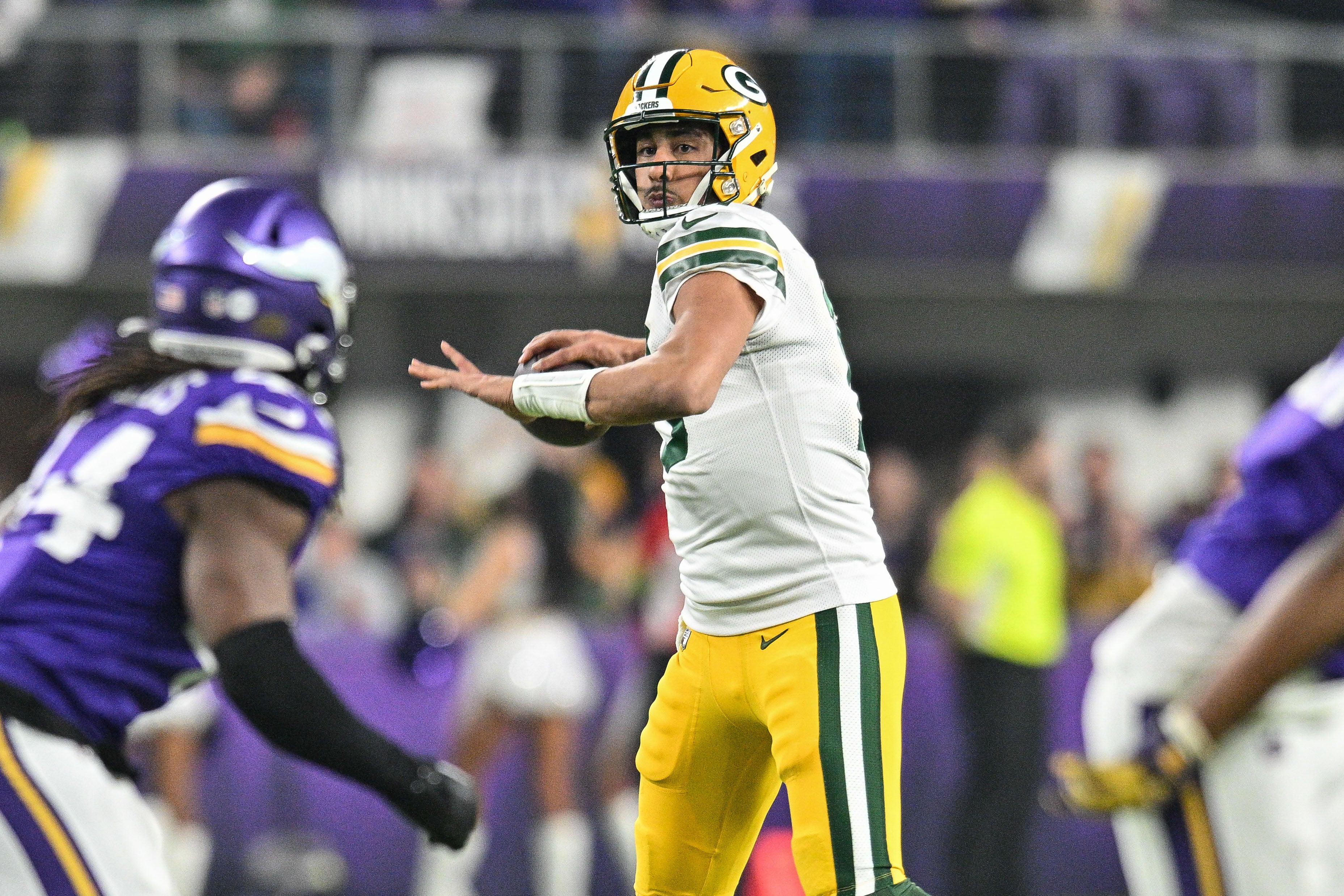 Green Bay Packers quarterback Jordan Love (10) in action during the game against the Minnesota Vikings at U.S. Bank Stadium.