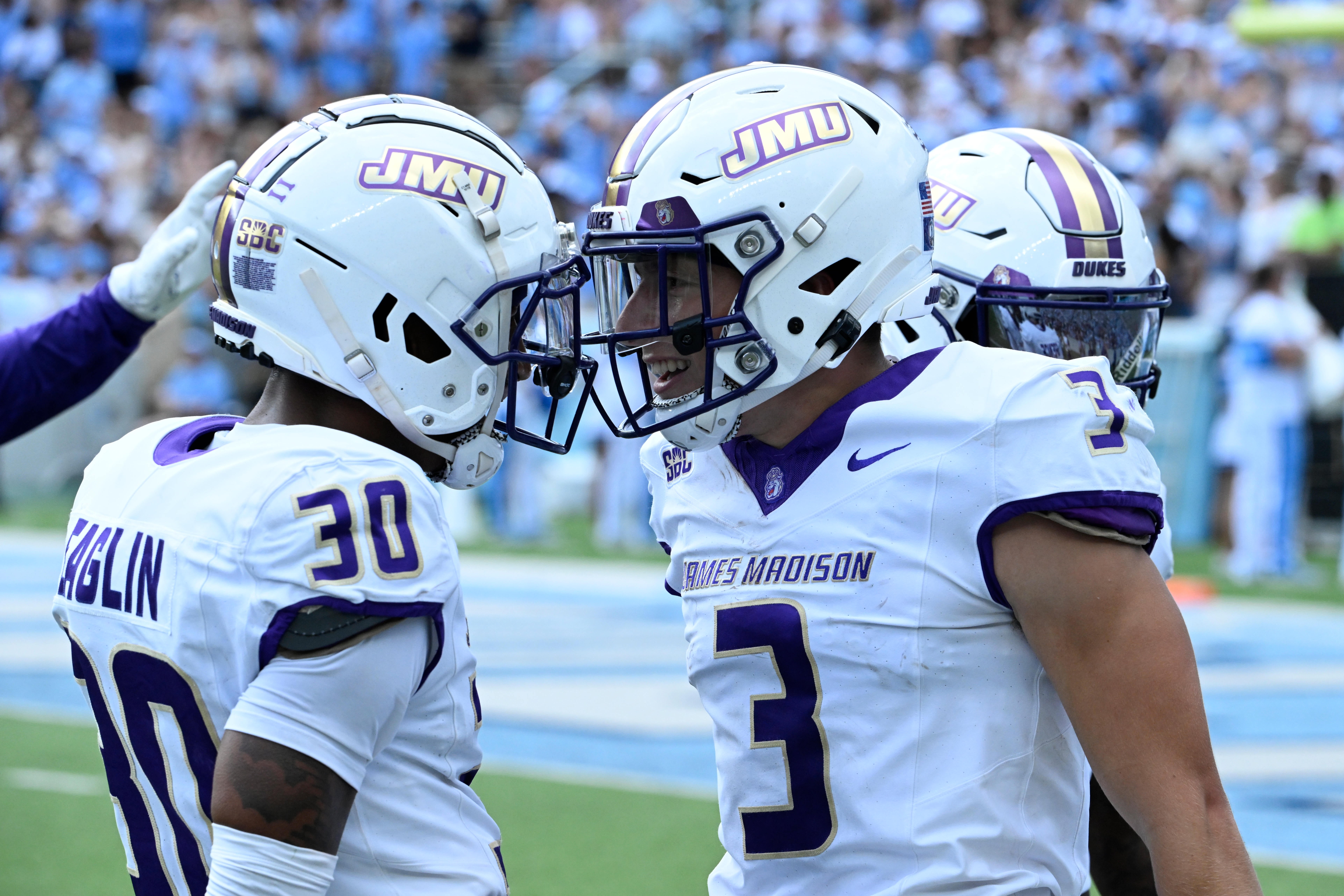 Sep 21, 2024; Chapel Hill, North Carolina, USA; James Madison Dukes cornerback Terrence Spence (3) reacts with cornerback Justin Eaglin (30) after intercepting the ball in the second quarter at Kenan Memorial Stadium.