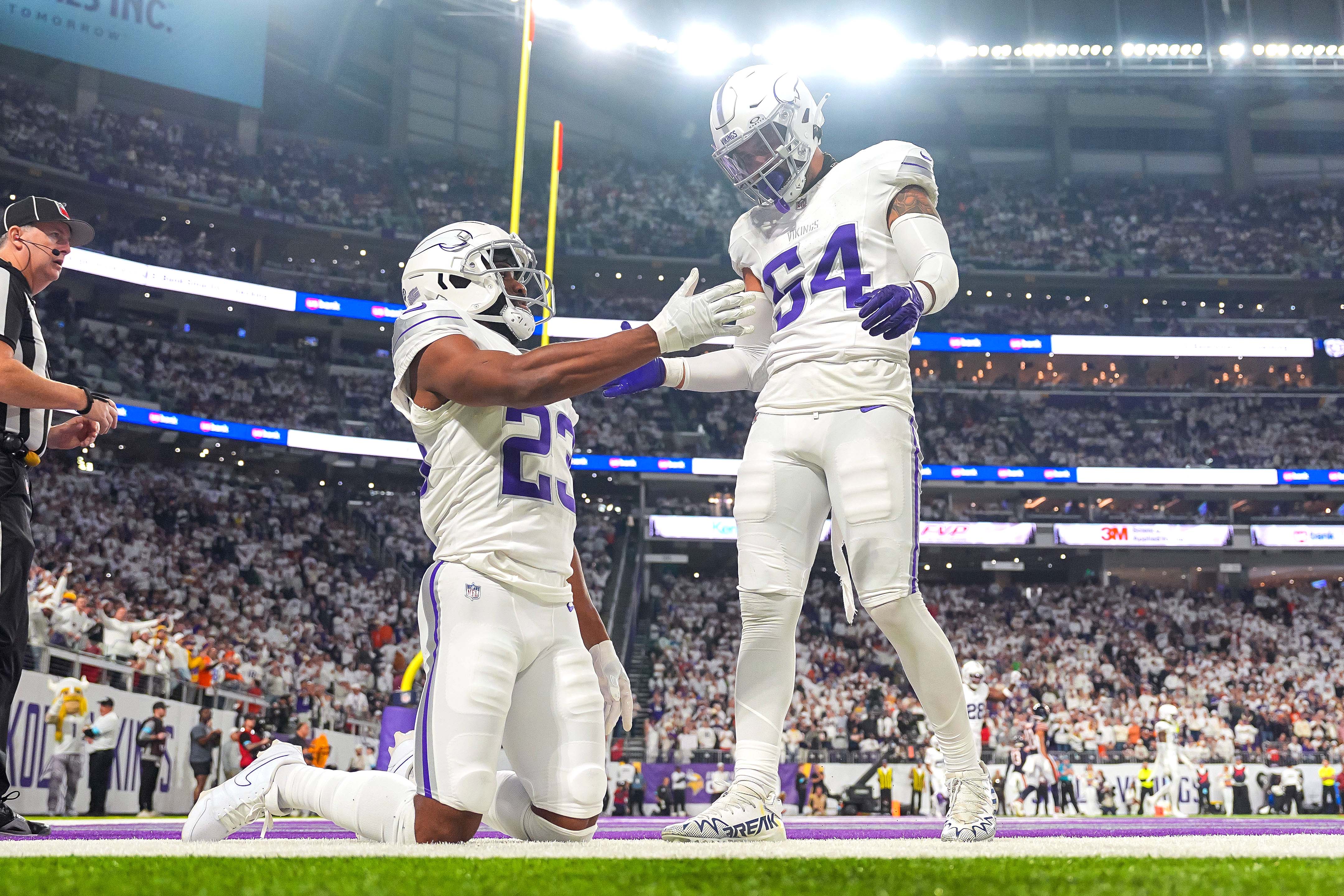 Dec 16, 2024; Minneapolis, Minnesota, USA; Minnesota Vikings cornerback Fabian Moreau (23) and linebacker Kamu Grugier-Hill (54) celebrate a play against the Chicago Bears in the fourth quarter at U.S. Bank Stadium.