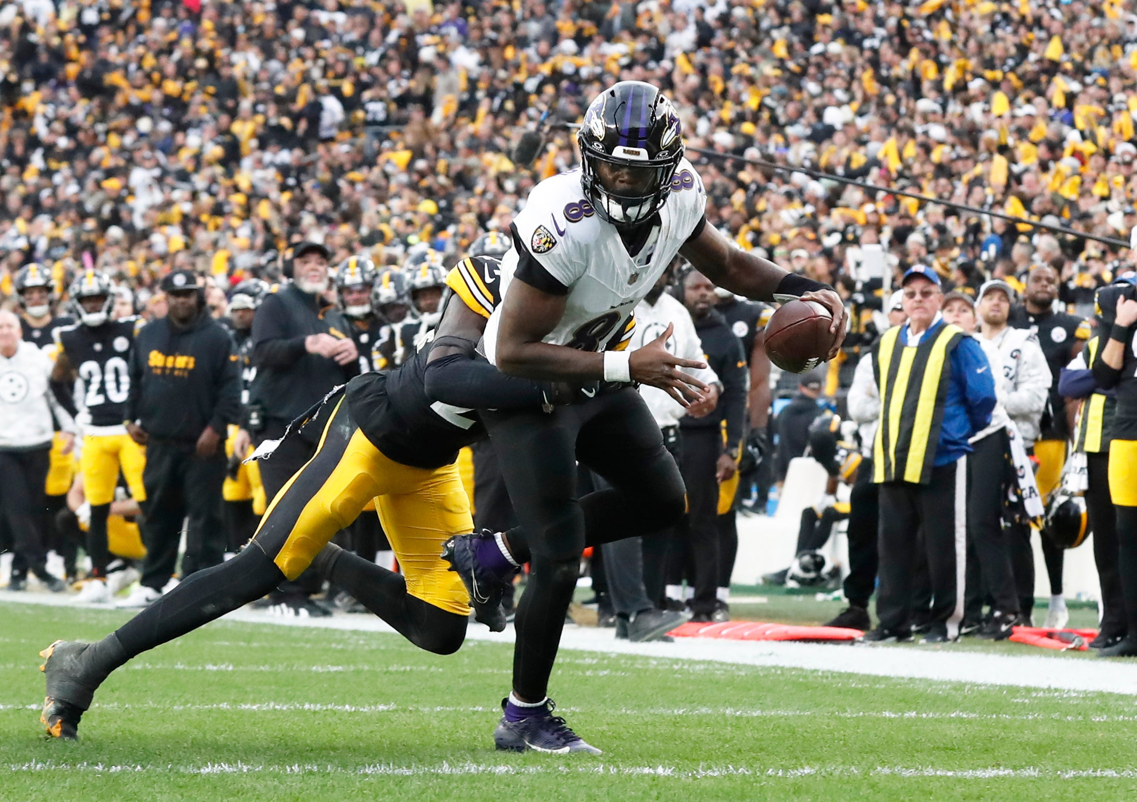 Nov 17, 2024; Pittsburgh, Pennsylvania, USA; Pittsburgh Steelers cornerback Joey Porter Jr. (24) stops Baltimore Ravens quarterback Lamar Jackson (8) short of the end-zone on a two point conversion attempt during the fourth quarter at Acrisure Stadium.