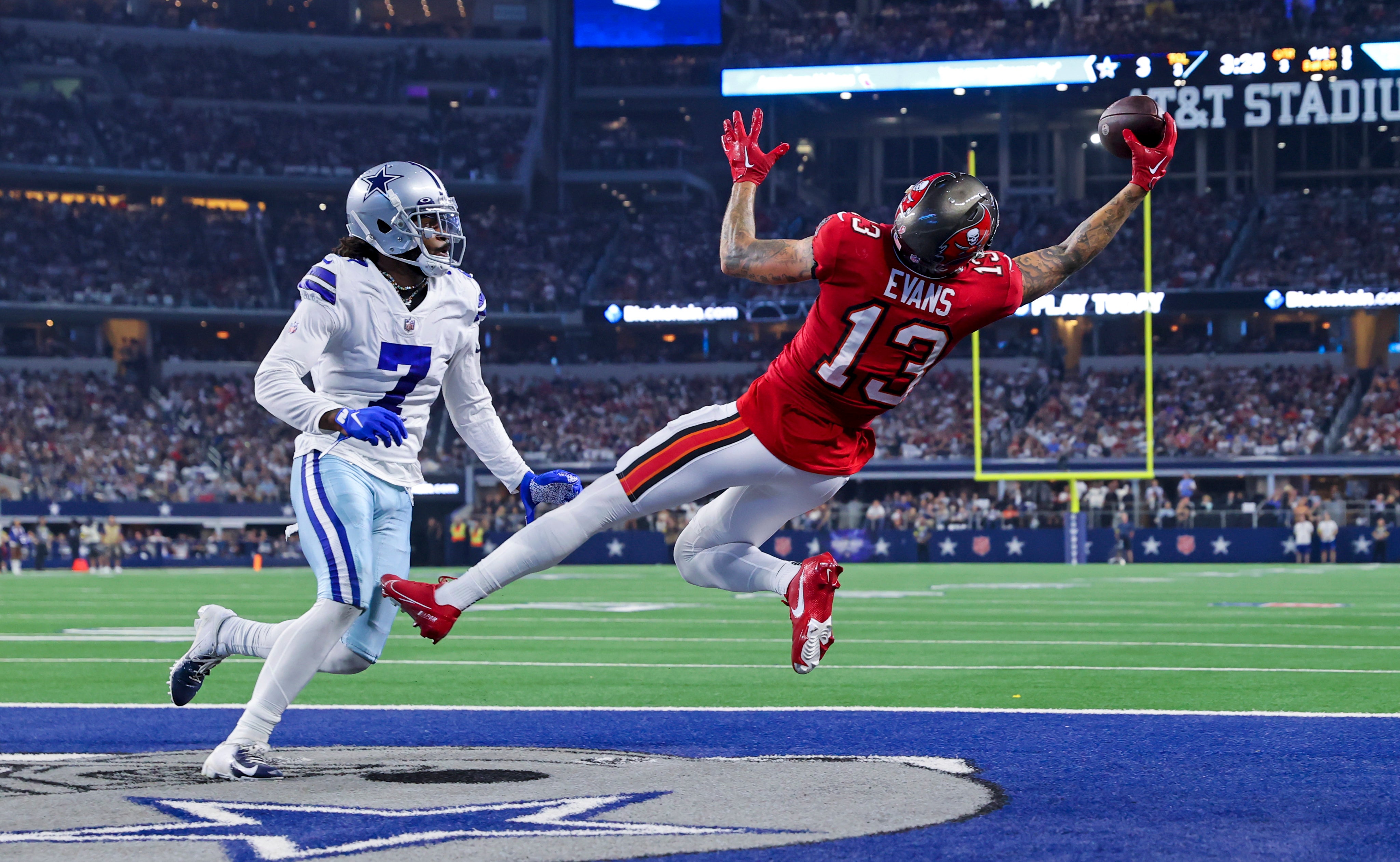 Sep 11, 2022; Arlington, Texas, USA; Tampa Bay Buccaneers wide receiver Mike Evans (13) makes a leaping touchdown catch over Dallas Cowboys cornerback Trevon Diggs (7) during the third quarter at AT&T Stadium.