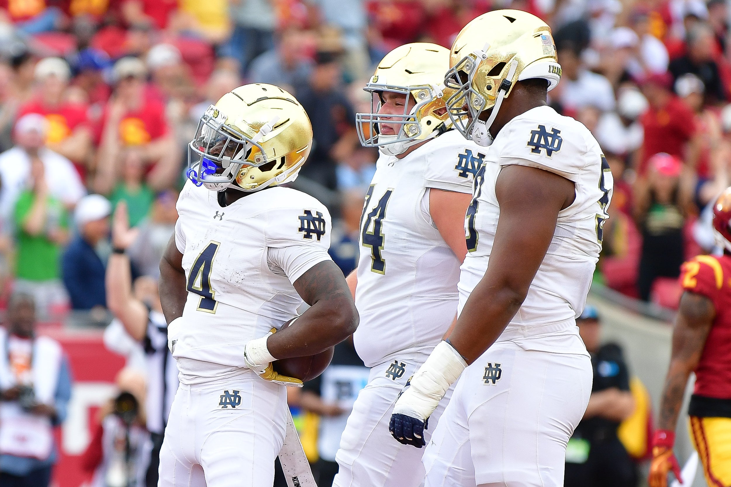 Notre Dame Fighting Irish running back Jeremiyah Love (4) celebrates his touchdown scored against the Southern California Trojans during the first half at the Los Angeles Memorial Coliseum.