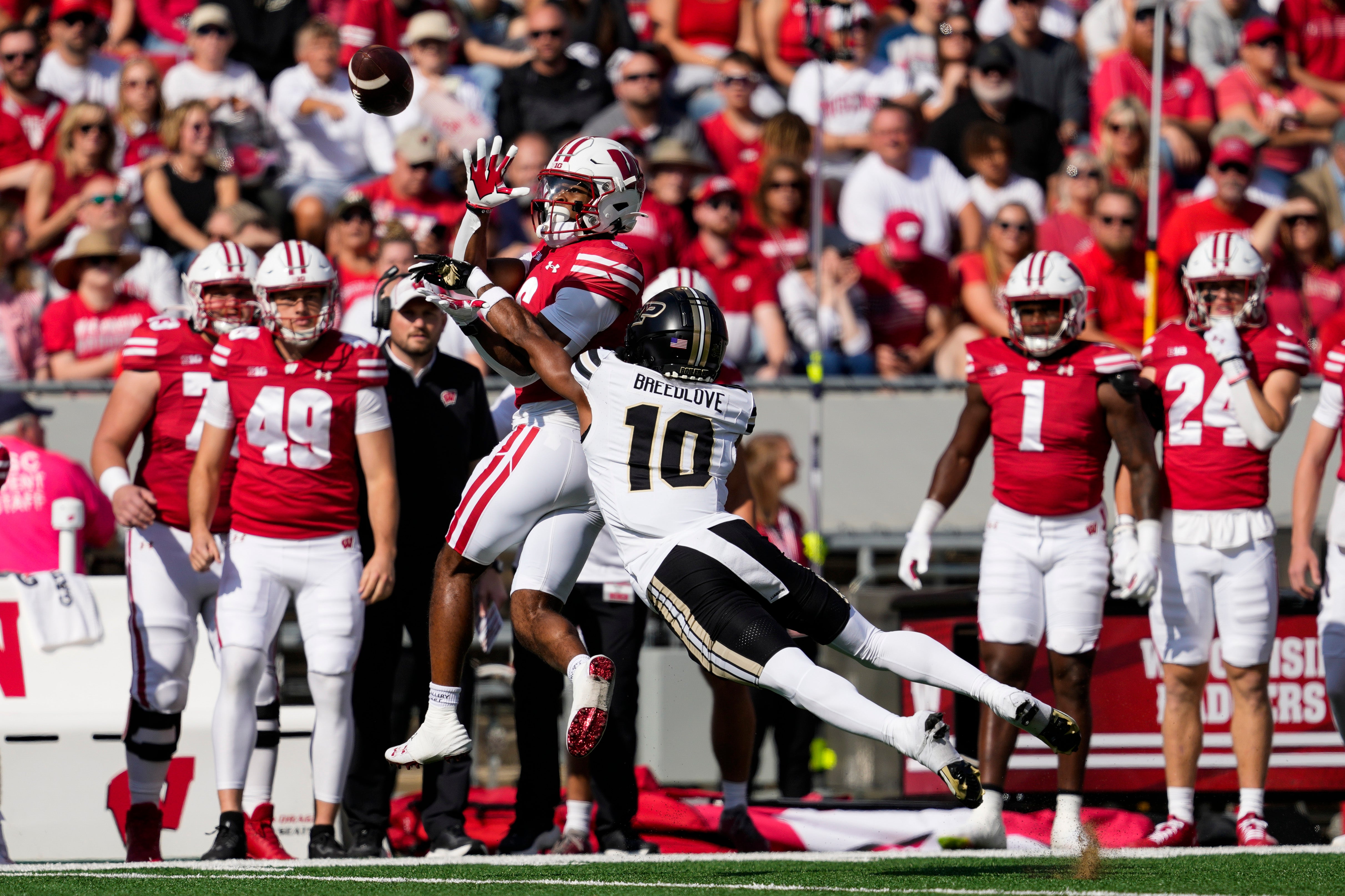 Purdue Boilermakers defensive back Kyndrich Breedlove (10) defends the pass intended for Wisconsin Badgers wide receiver Will Pauling (6) during the first quarter at Camp Randall Stadium.