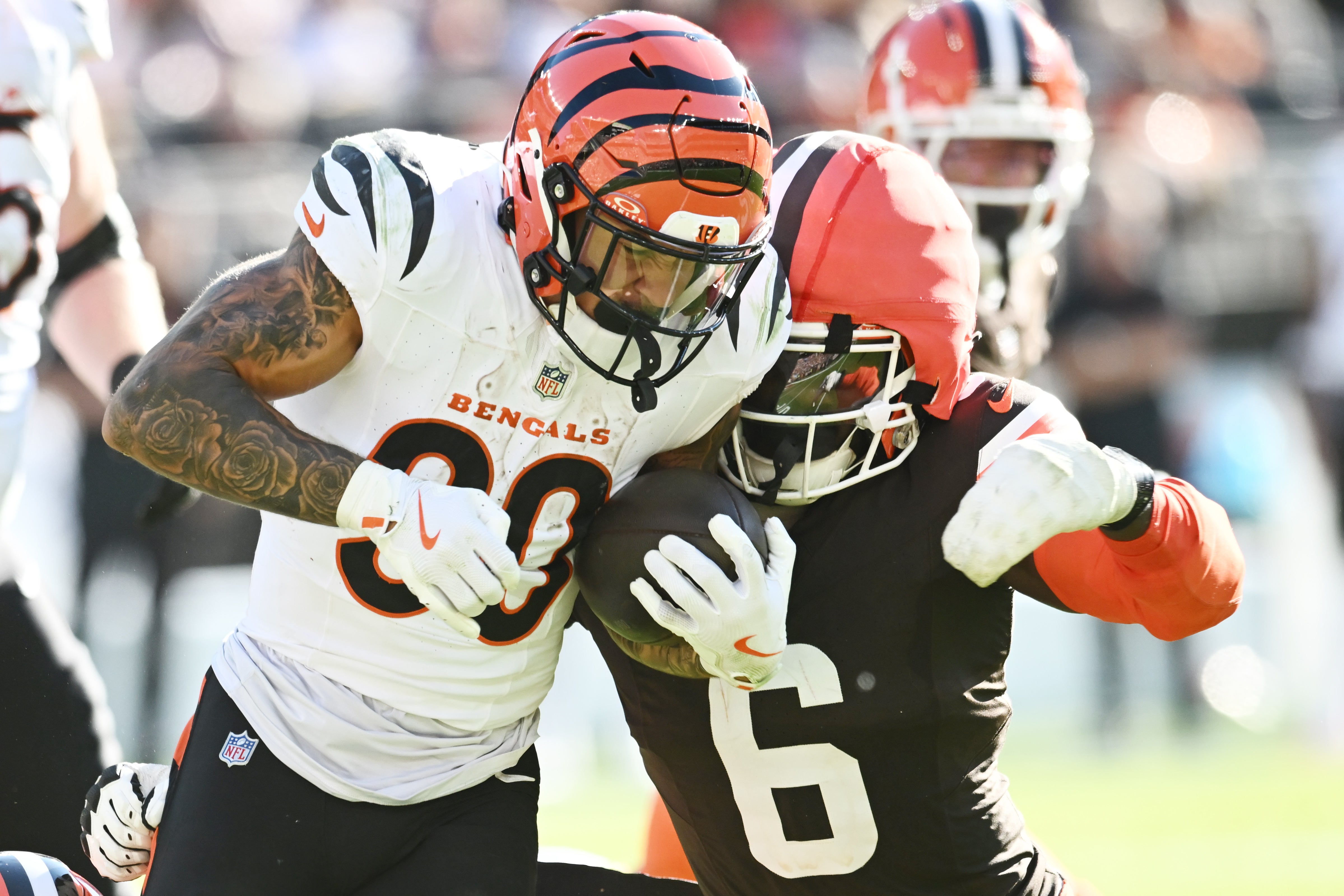 Oct 20, 2024; Cleveland, Ohio, USA; Cleveland Browns linebacker Jeremiah Owusu-Koramoah (6) tackles Cincinnati Bengals running back Chase Brown (30) during the second half at Huntington Bank Field.
