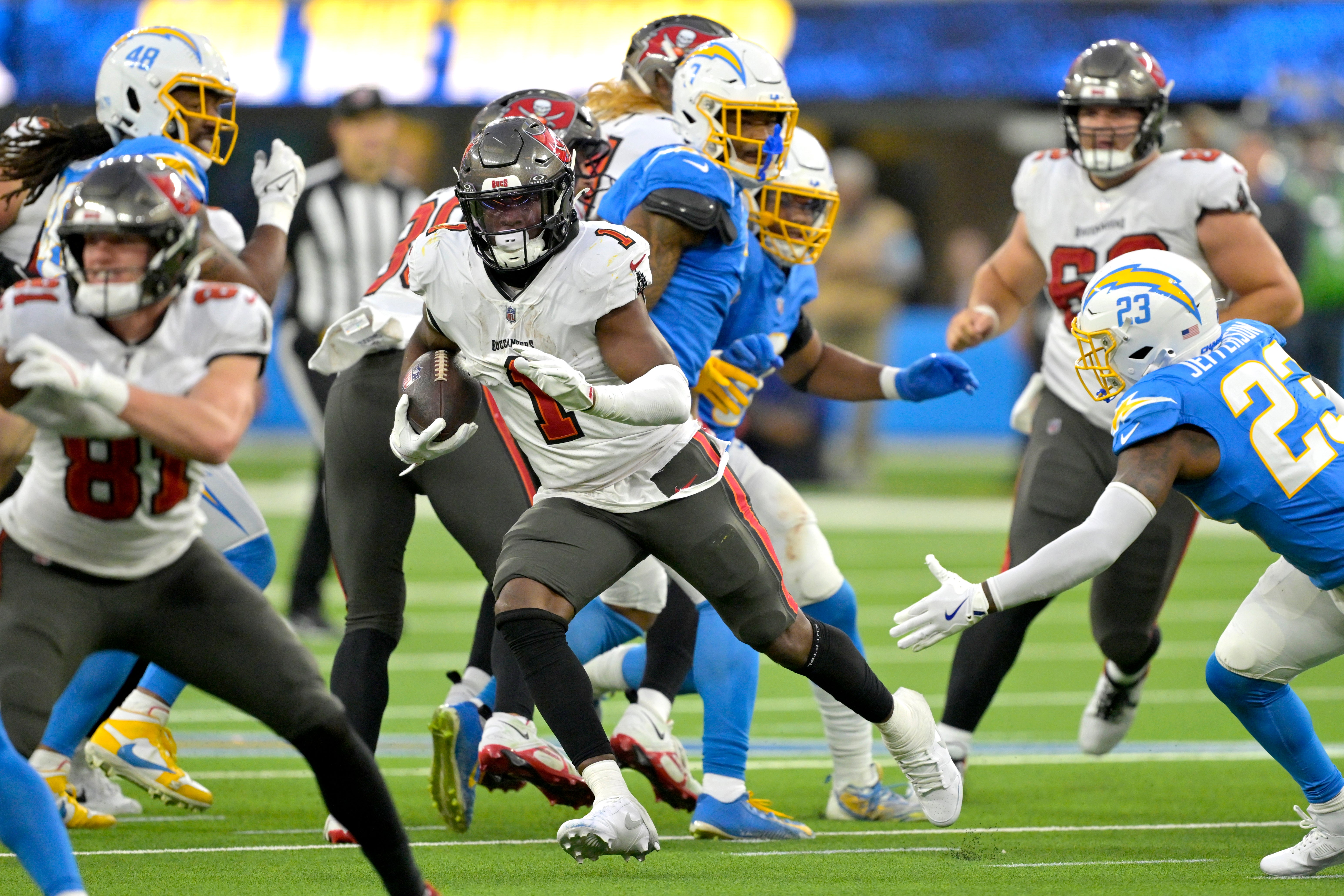 Dec 15, 2024; Inglewood, California, USA; Tampa Bay Buccaneers running back Rachaad White (1) carries the ball for a 7-yard gain in the second half against the Los Angeles Chargers at SoFi Stadium.