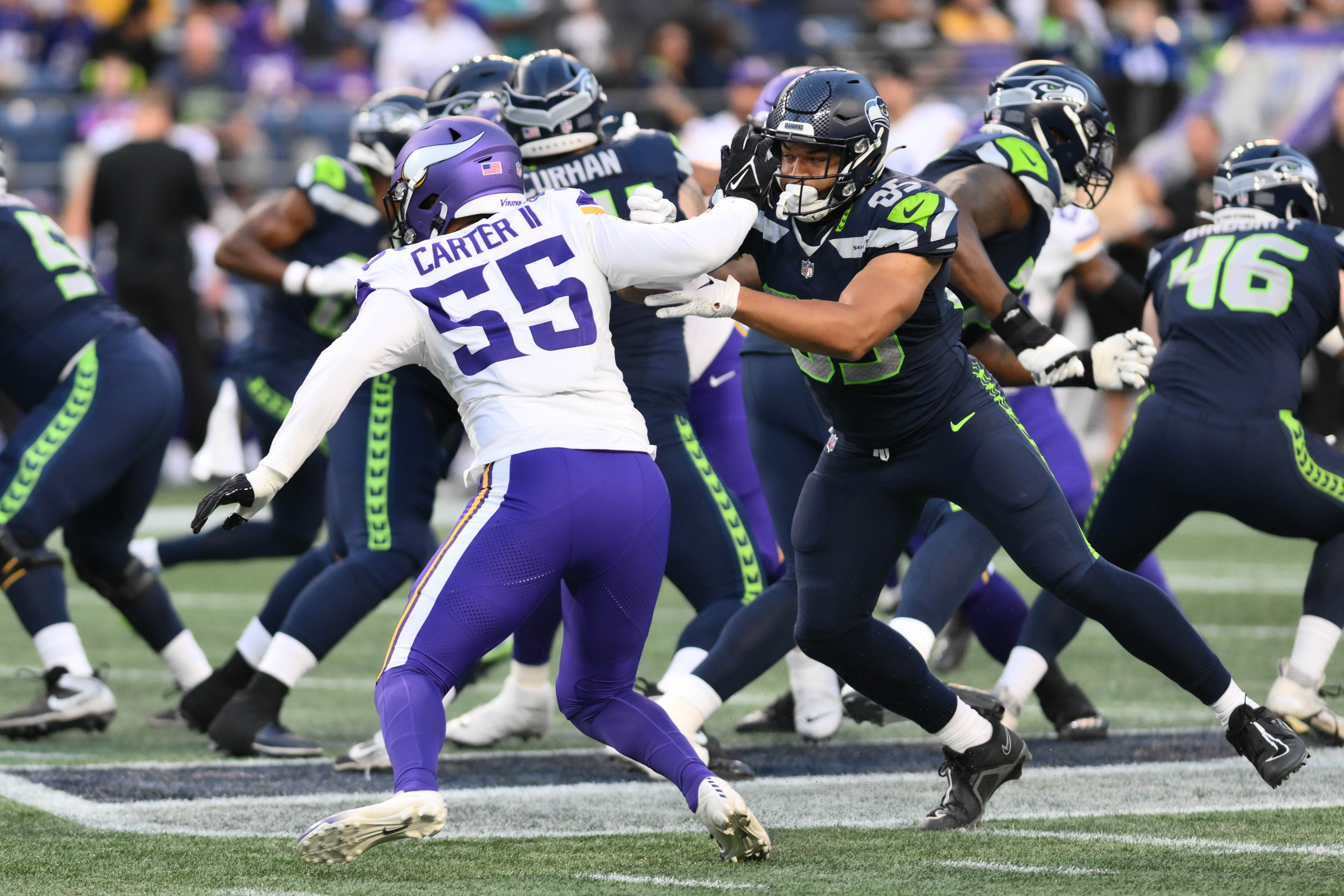 Aug 10, 2023; Seattle, Washington, USA; Seattle Seahawks tight end Tyler Mabry (85) blocks Minnesota Vikings linebacker Andre Carter II (55) during the game at Lumen Field.