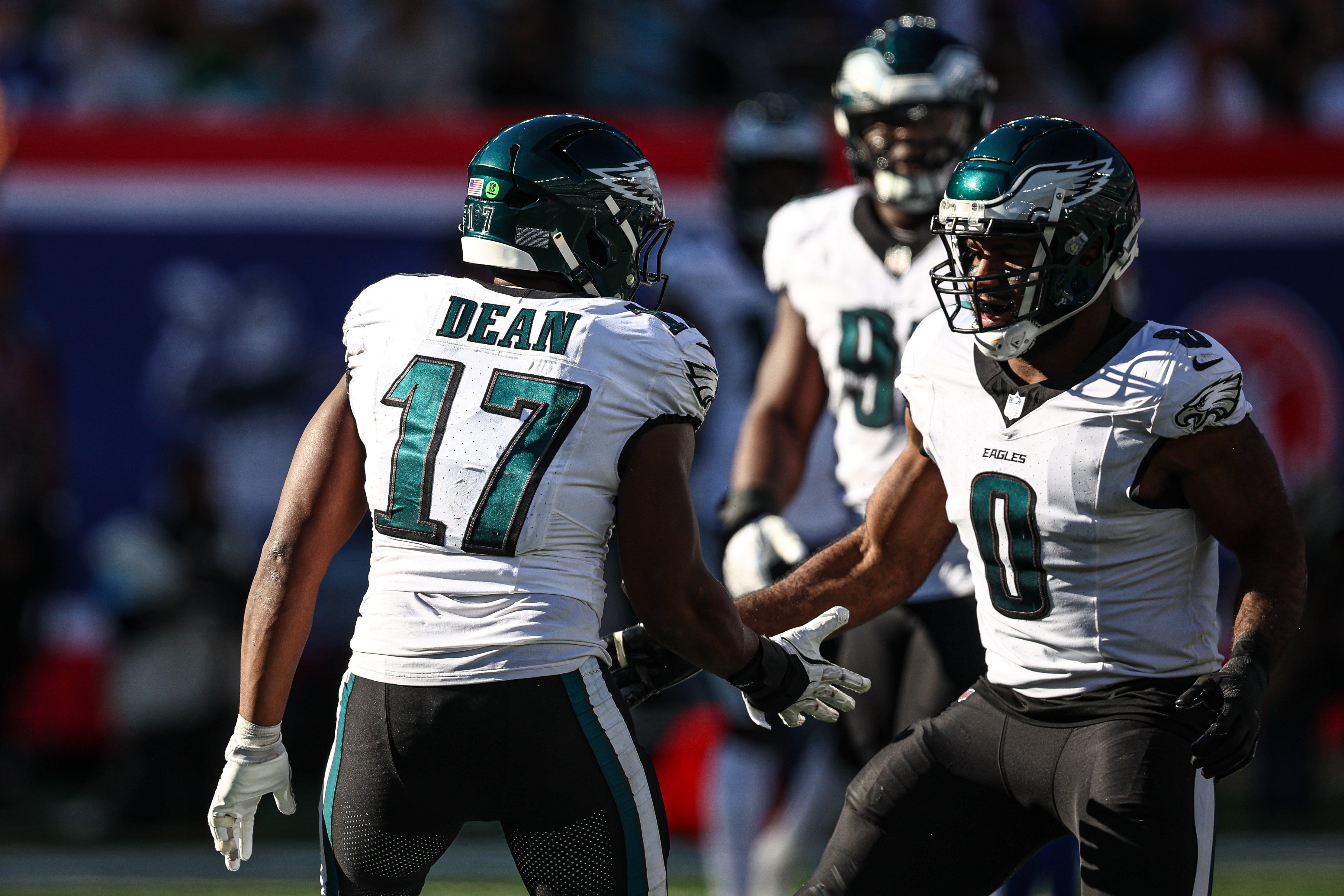 Philadelphia Eagles linebacker Nakobe Dean (17) and defensive end Bryce Huff (0) celebrate after a defensive stop during the second half against the New York Giants at MetLife Stadium.