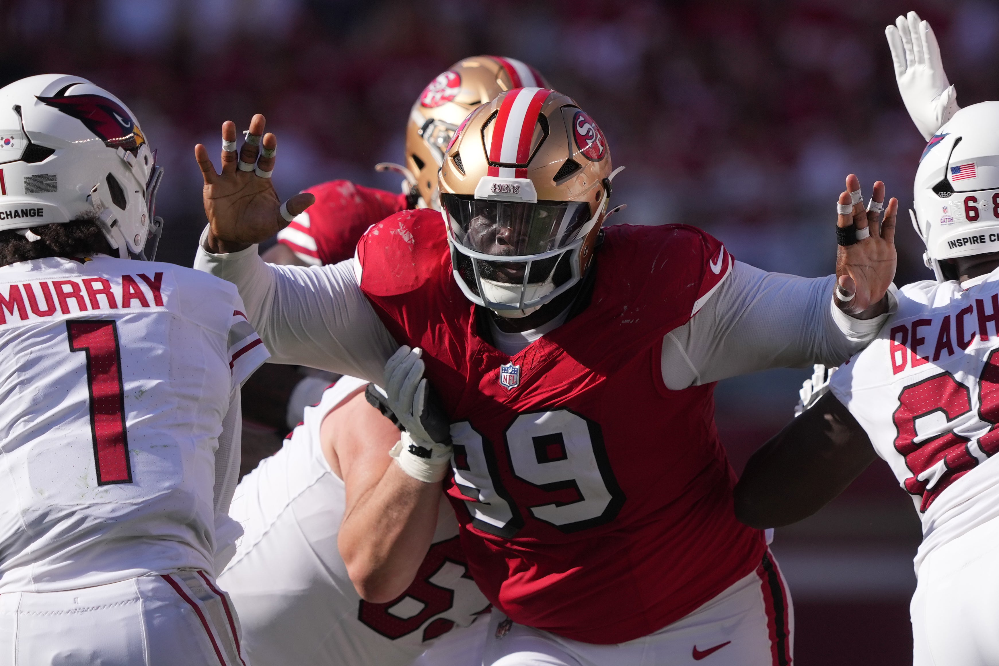 San Francisco 49ers defensive tackle Maliek Collins (99) pressures Arizona Cardinals quarterback Kyler Murray (1) during the fourth quarter at Levi's Stadium.