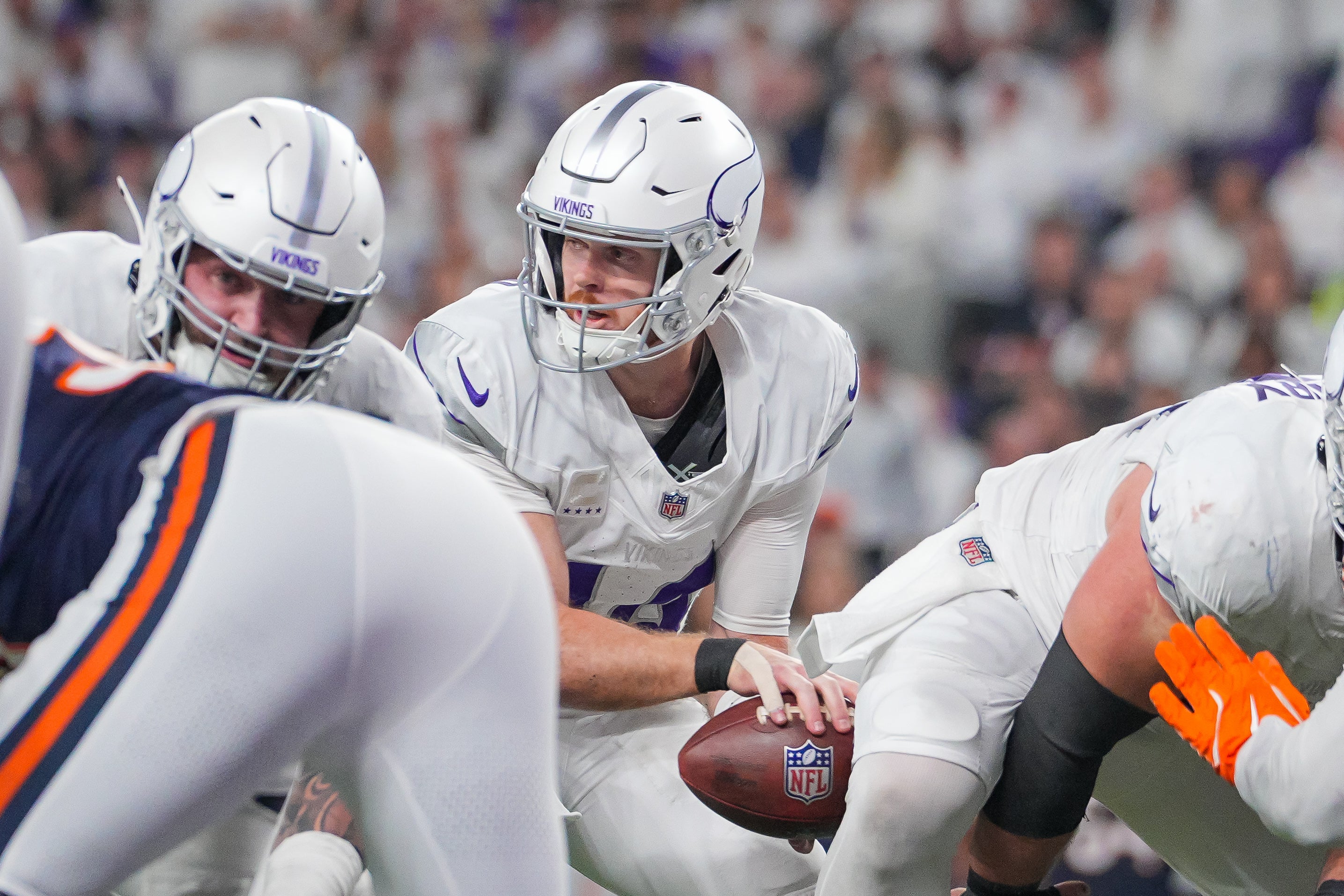 Dec 16, 2024; Minneapolis, Minnesota, USA; Minnesota Vikings quarterback Sam Darnold (14) under center against the Chicago Bears in the fourth quarter at U.S. Bank Stadium.