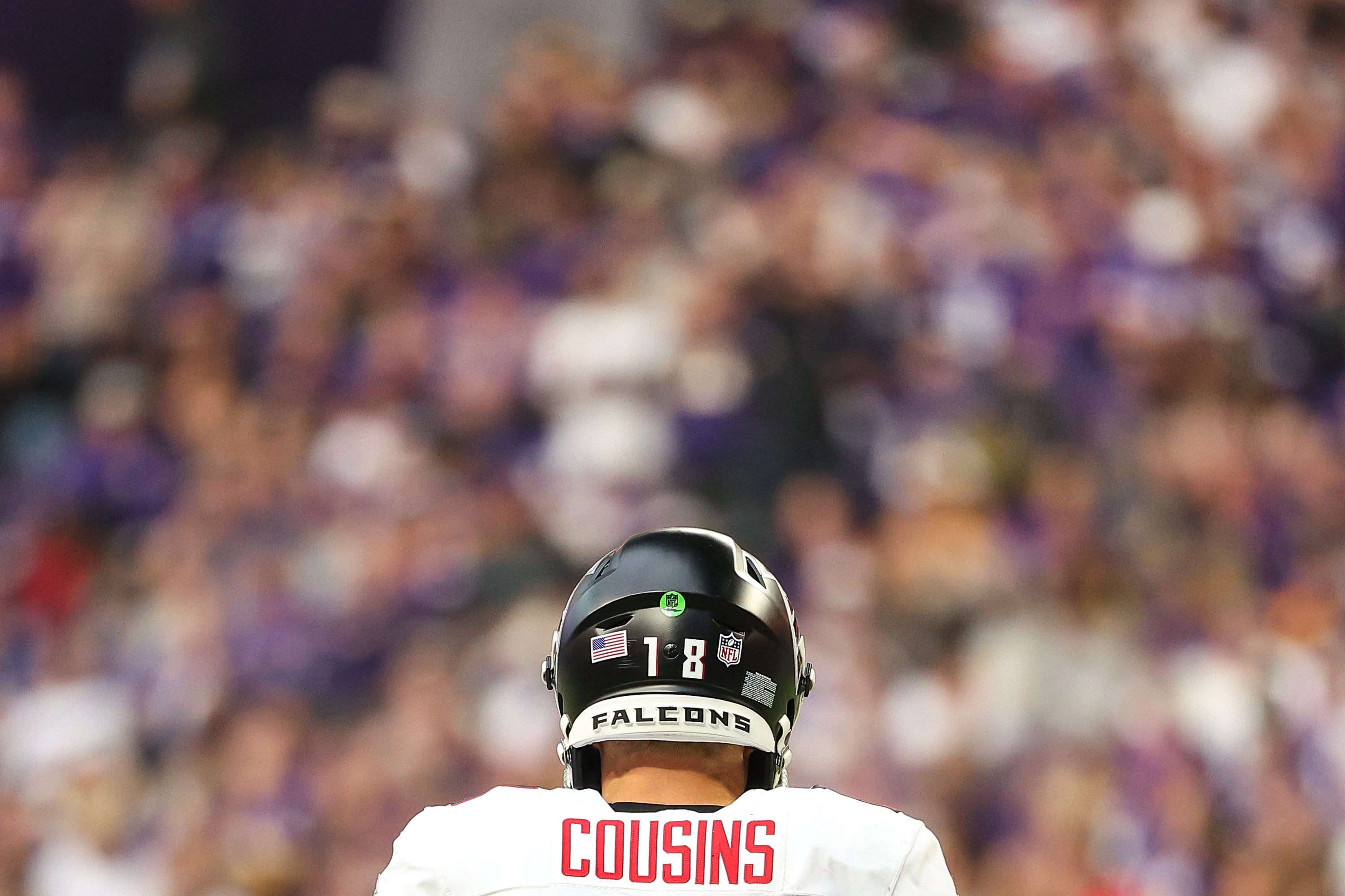 Dec 8, 2024; Minneapolis, Minnesota, USA; Atlanta Falcons quarterback Kirk Cousins (18) looks on during the second quarter against the Minnesota Vikings at U.S. Bank Stadium.