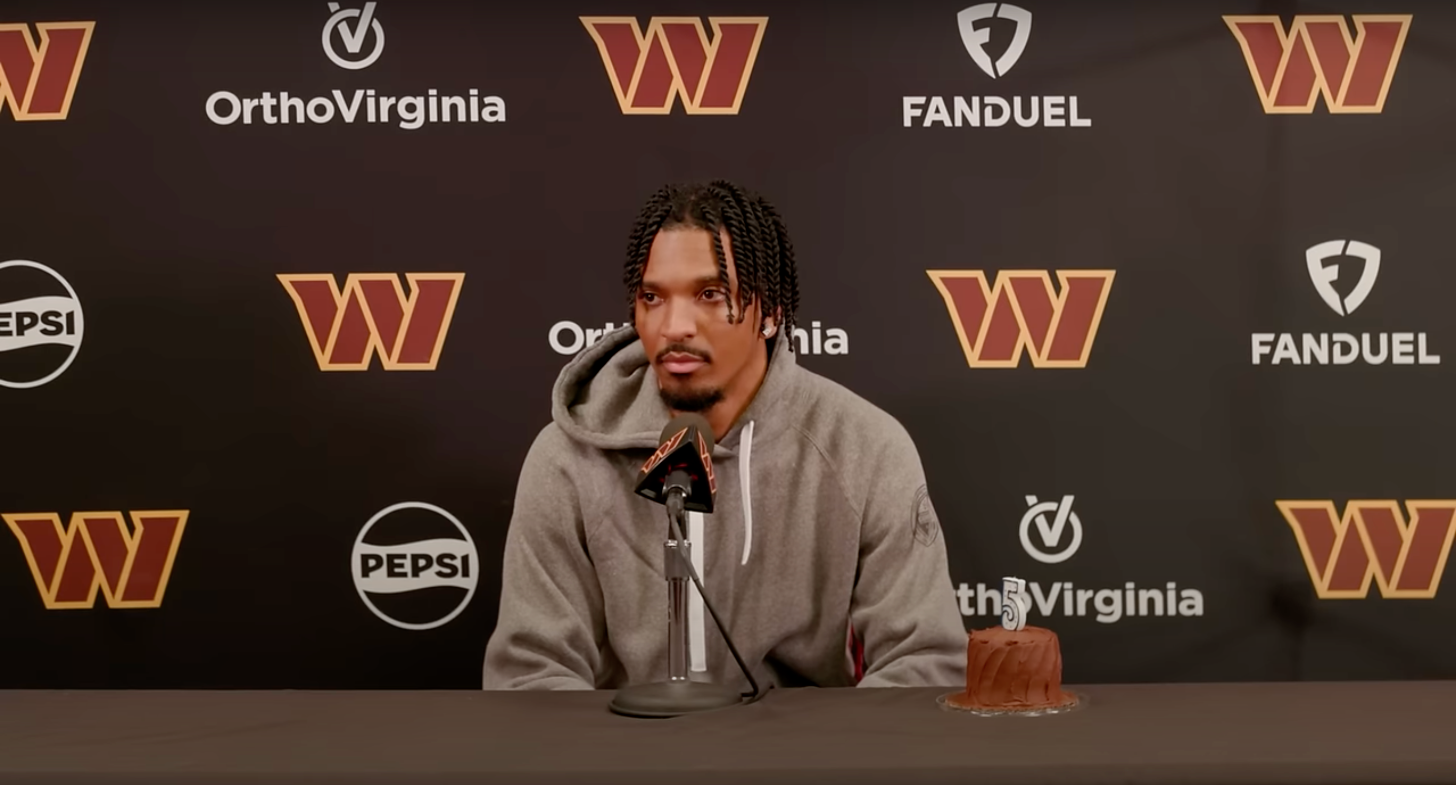 Jayden Daniels talks to reporters on Wednesday ahead of the Commanders' matchup against the Eagles.