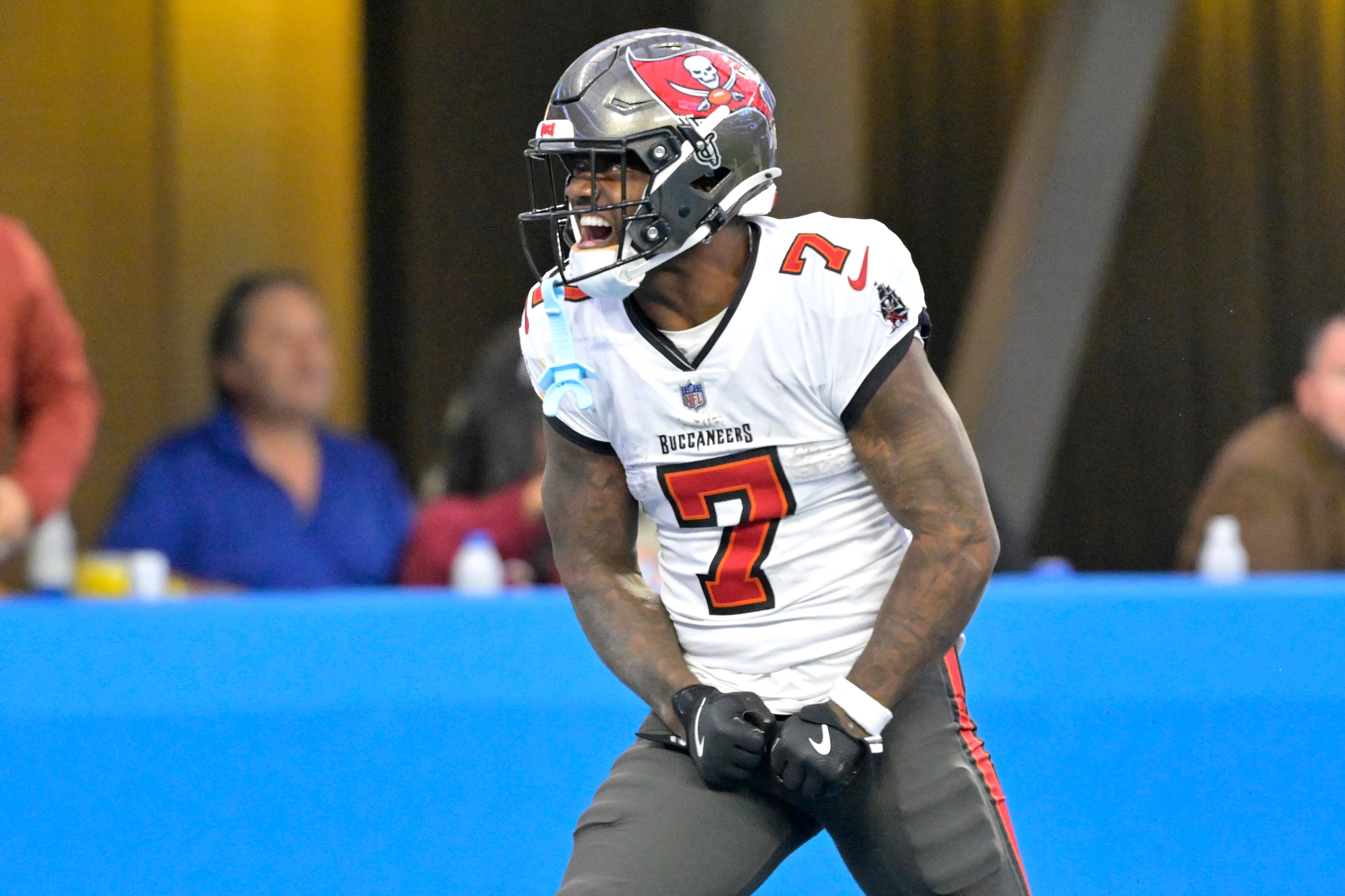 Dec 15, 2024; Inglewood, California, USA; Tampa Bay Buccaneers running back Bucky Irving (7) celebrates after a 54-yard run in the second half against the Los Angeles Chargers at SoFi Stadium.