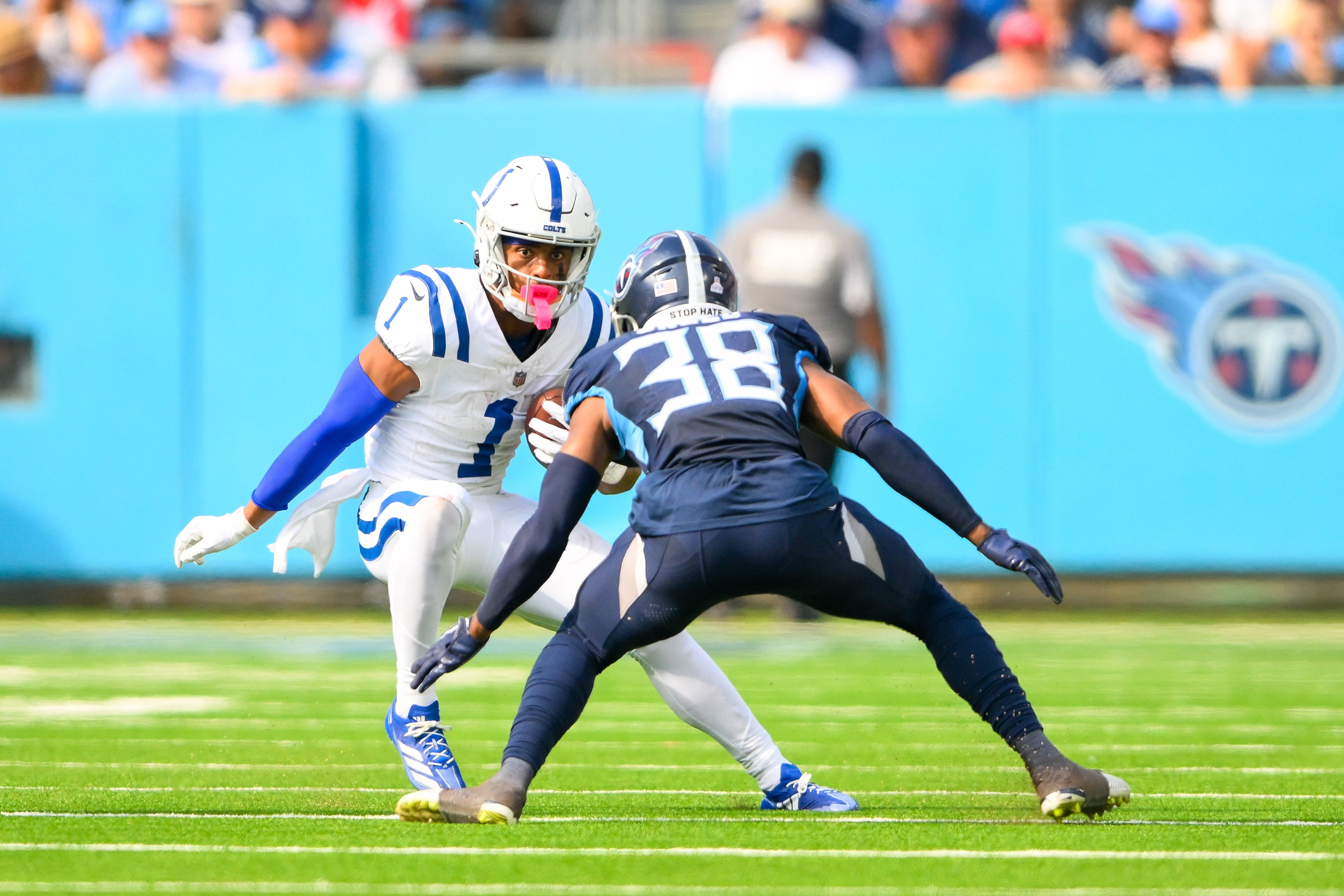 Oct 13, 2024; Nashville, Tennessee, USA; Indianapolis Colts wide receiver Josh Downs (1) runs the ball as Tennessee Titans cornerback L'Jarius Sneed (38) defends during the second half at Nissan Stadium.