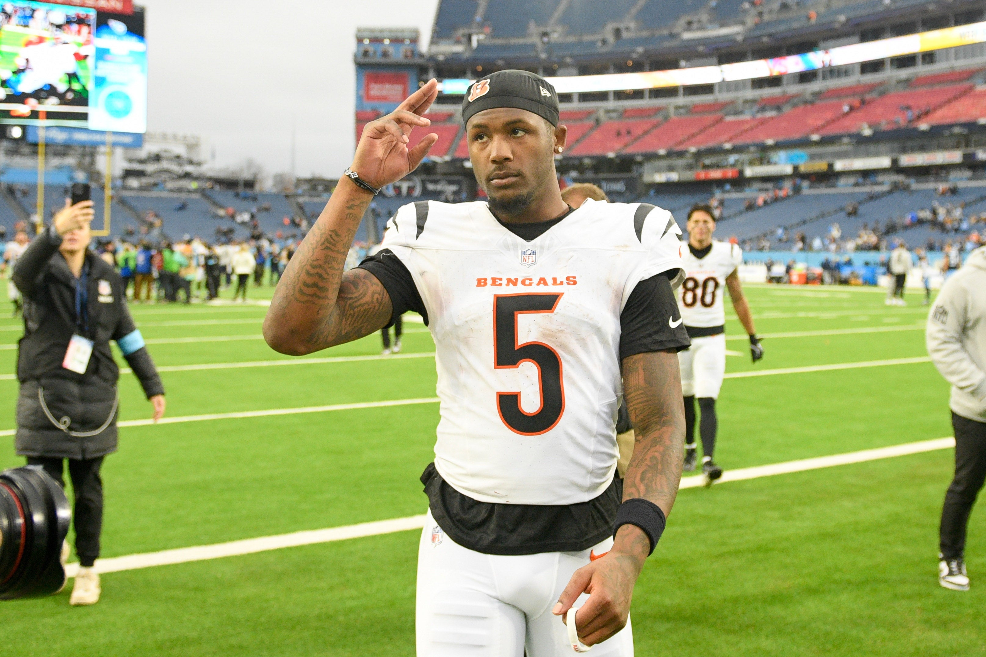 Dec 15, 2024; Nashville, Tennessee, USA; Cincinnati Bengals wide receiver Tee Higgins (5) salutes the Cincinnati Bengals fans that traveled against the Tennessee Titans post game at Nissan Stadium.