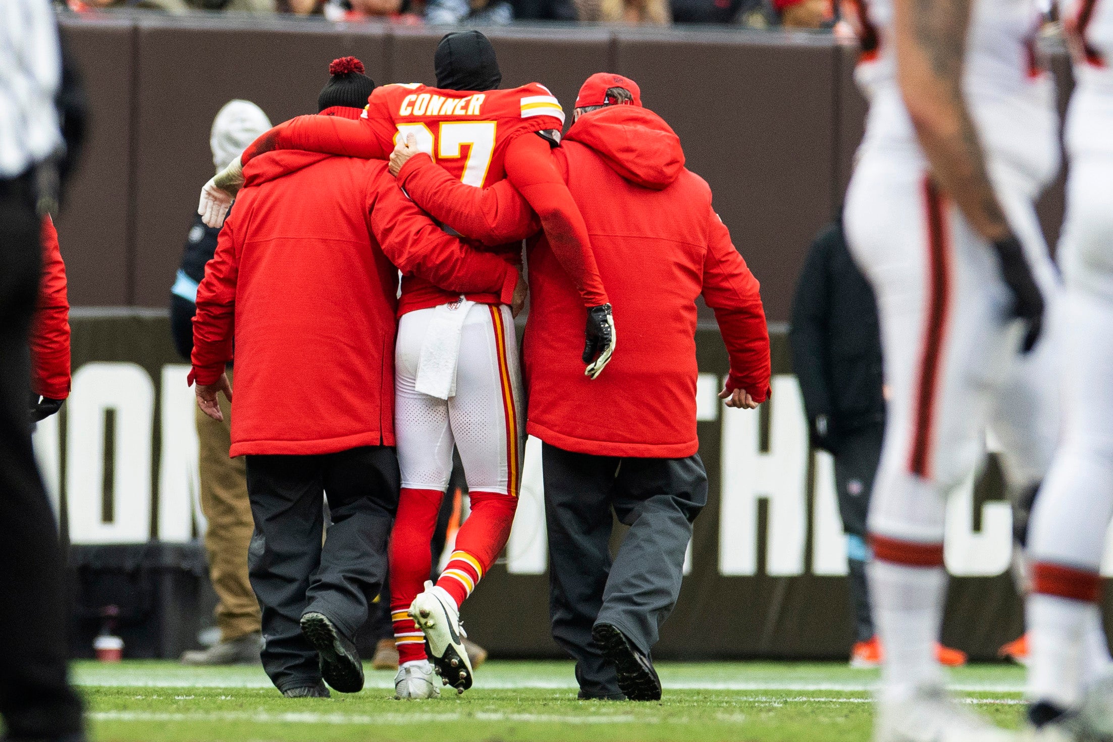 Dec 15, 2024; Cleveland, Ohio, USA; Kansas City Chiefs safety Chamarri Conner (27) is helped to the locker room following an injury during the second quarter against the Cleveland Browns at Huntington Bank Field.