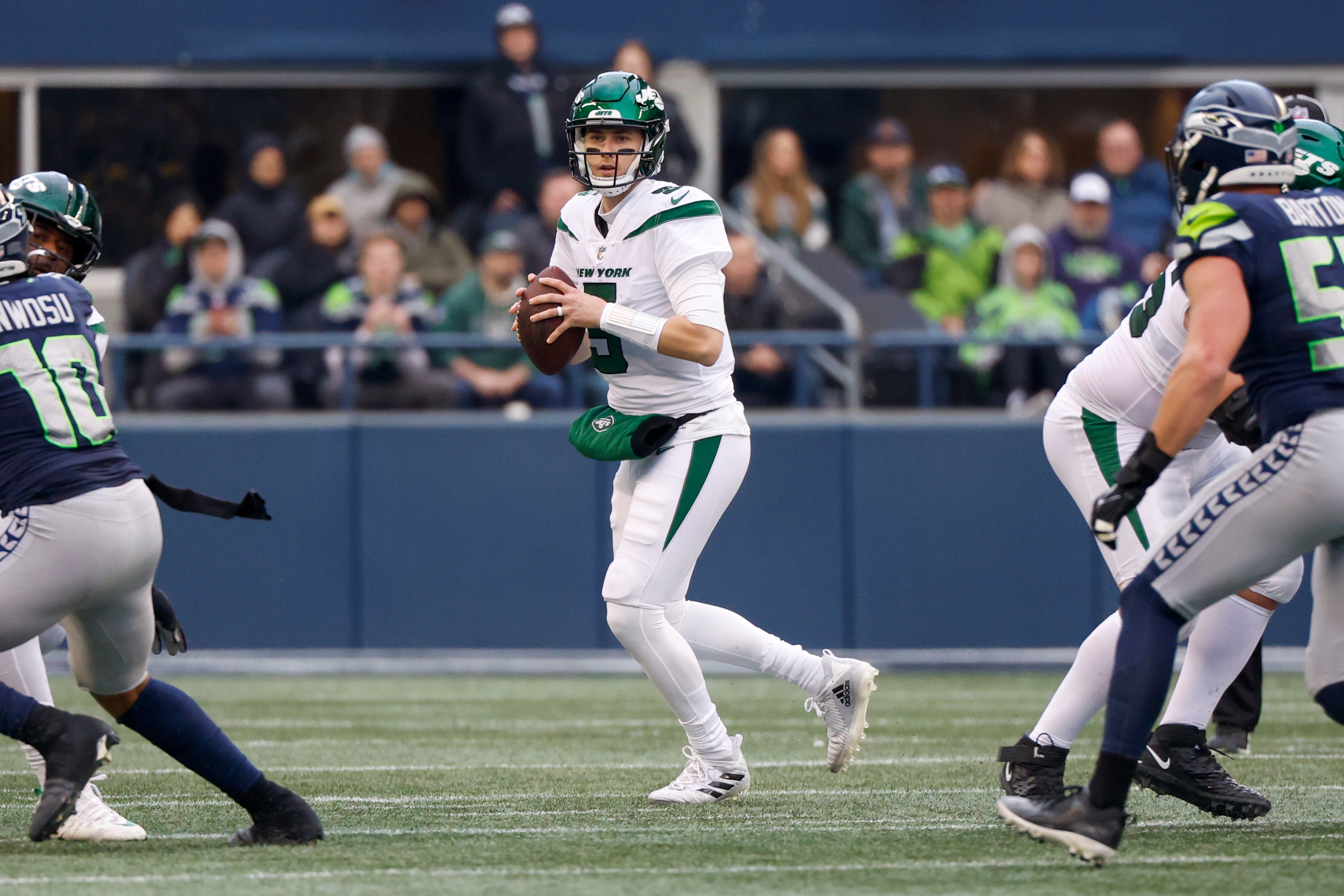 New York Jets quarterback Mike White (5) looks to pass against the Seattle Seahawks during the second quarter at Lumen Field.