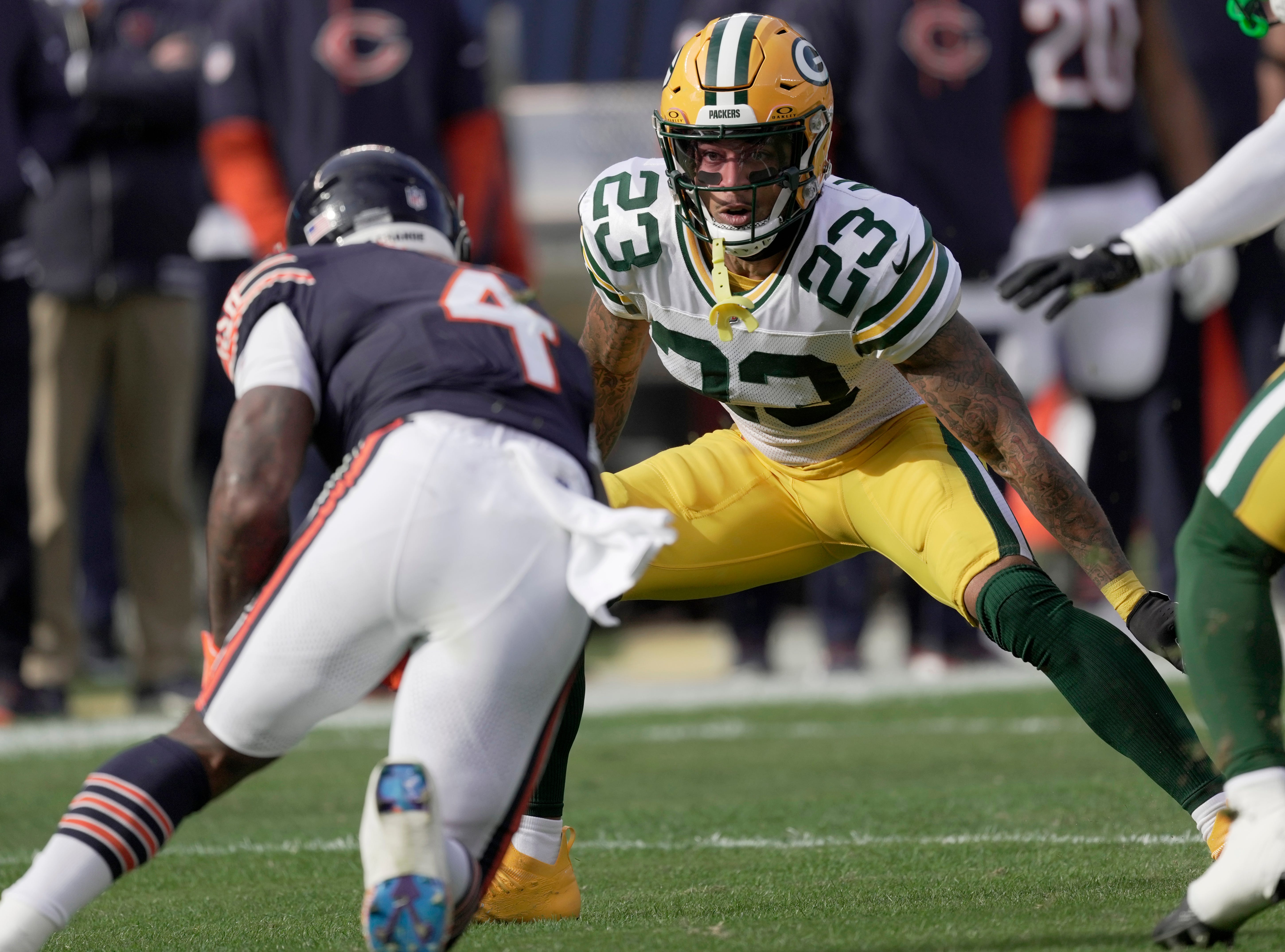 Green Bay Packers cornerback Jaire Alexander (23) tackles Chicago Bears running back D'Andre Swift (4) during the first quarter of their game Sunday, November 17, 2024 at Solider Field in Chicago, Illinois.