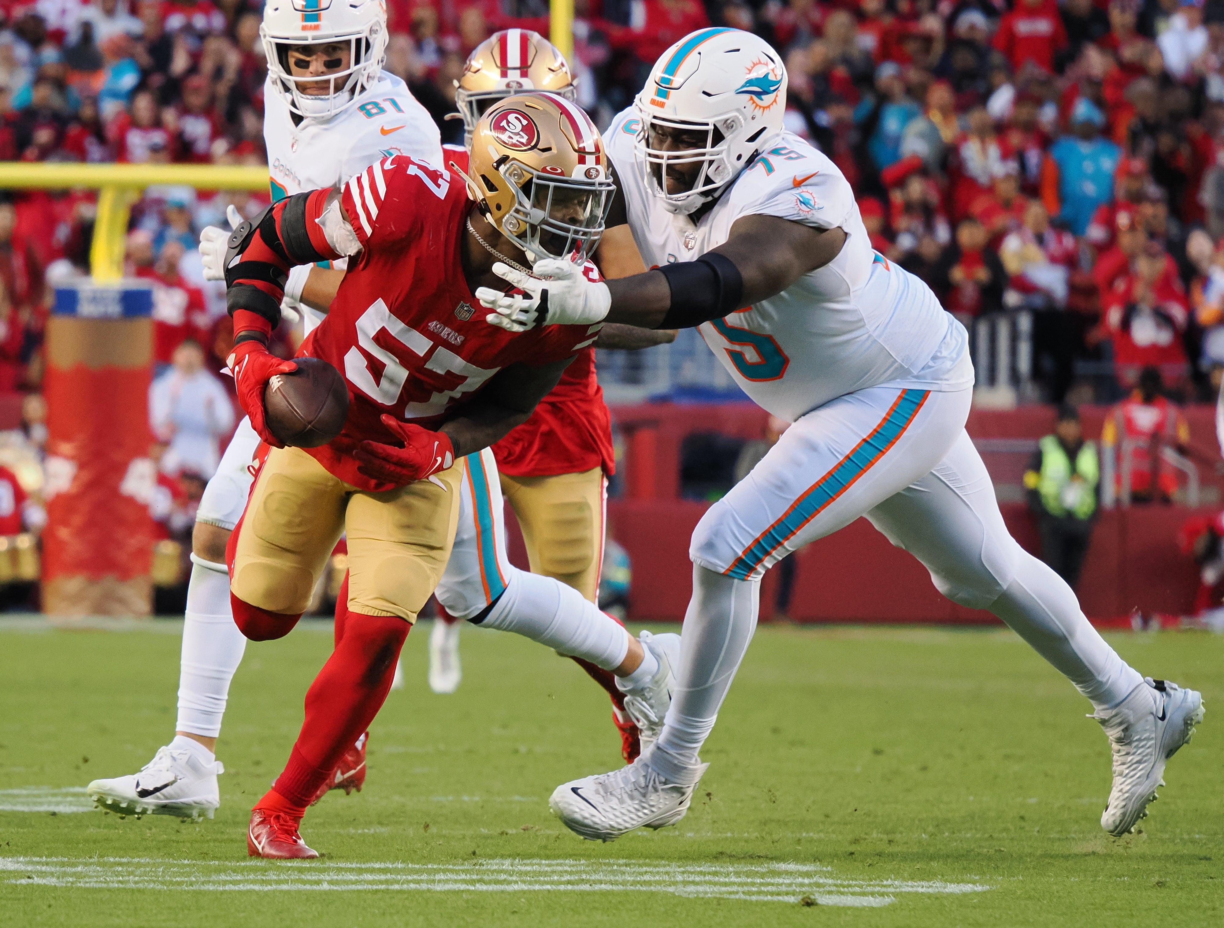 San Francisco 49ers linebacker Dre Greenlaw (57) recovers the fumble against Miami Dolphins offensive tackle Greg Little (75) for a touchdown during the fourth quarter at Levi's Stadium.