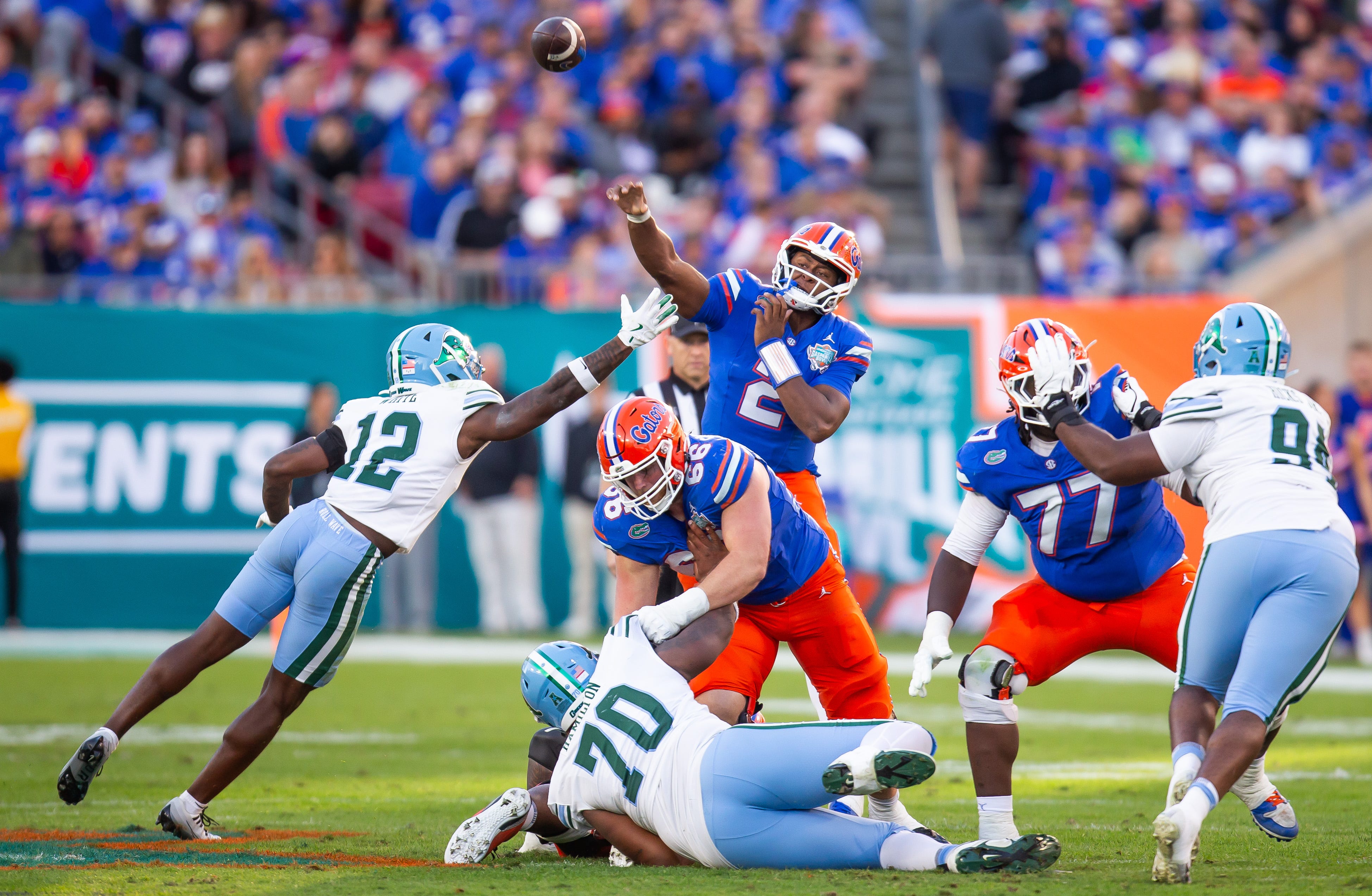 Florida Gators quarterback DJ Lagway (2) passes under pressure during the first half at Raymond James Stadium in Tampa, FL on Friday, December 20, 2024 in the 2024 Union Home Mortgage Gasparilla Bowl.