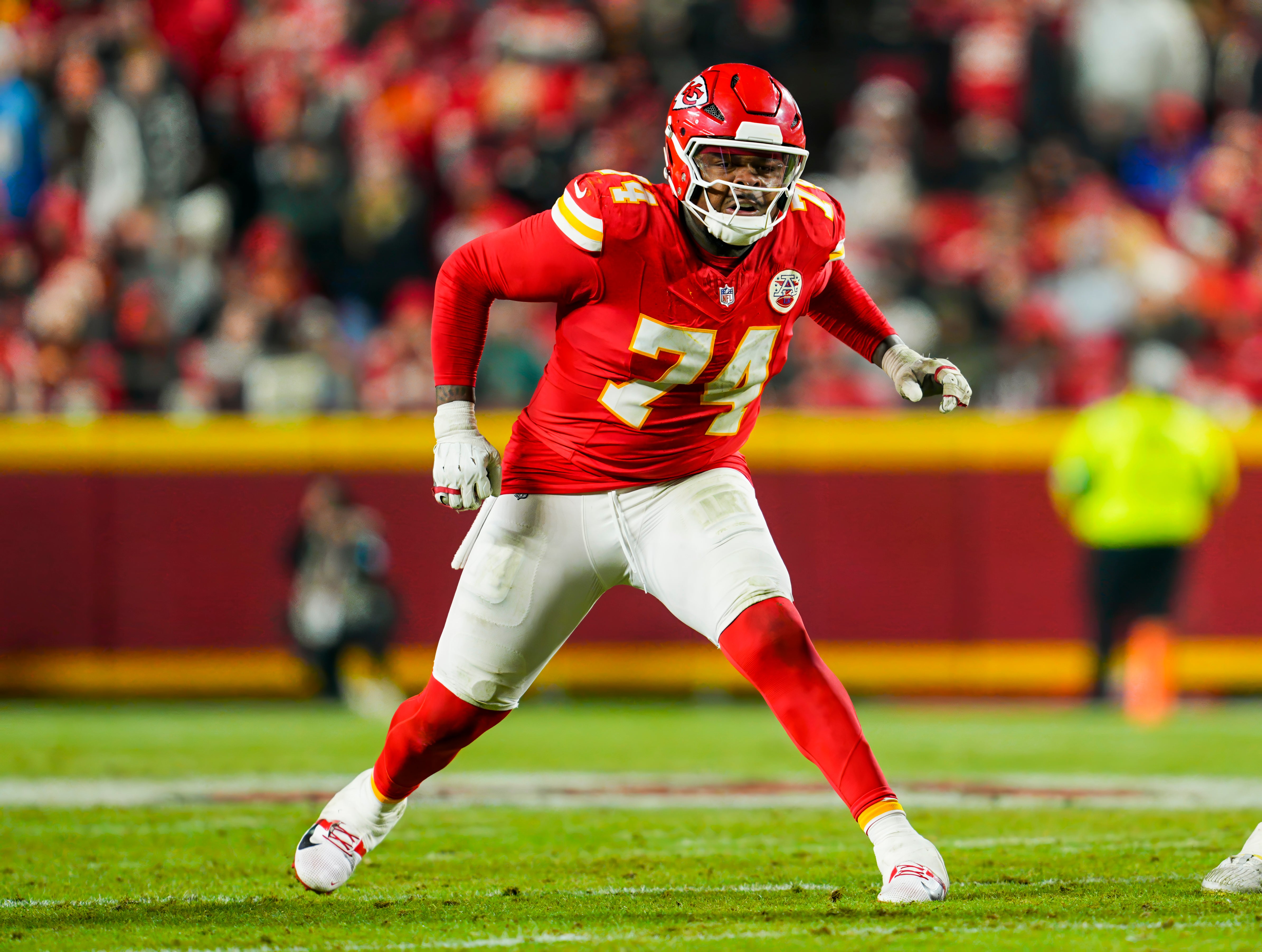 Dec 8, 2024; Kansas City, Missouri, USA; Kansas City Chiefs offensive tackle Jawaan Taylor (74) gets ready to block during the second half against the Los Angeles Chargers at GEHA Field at Arrowhead Stadium.