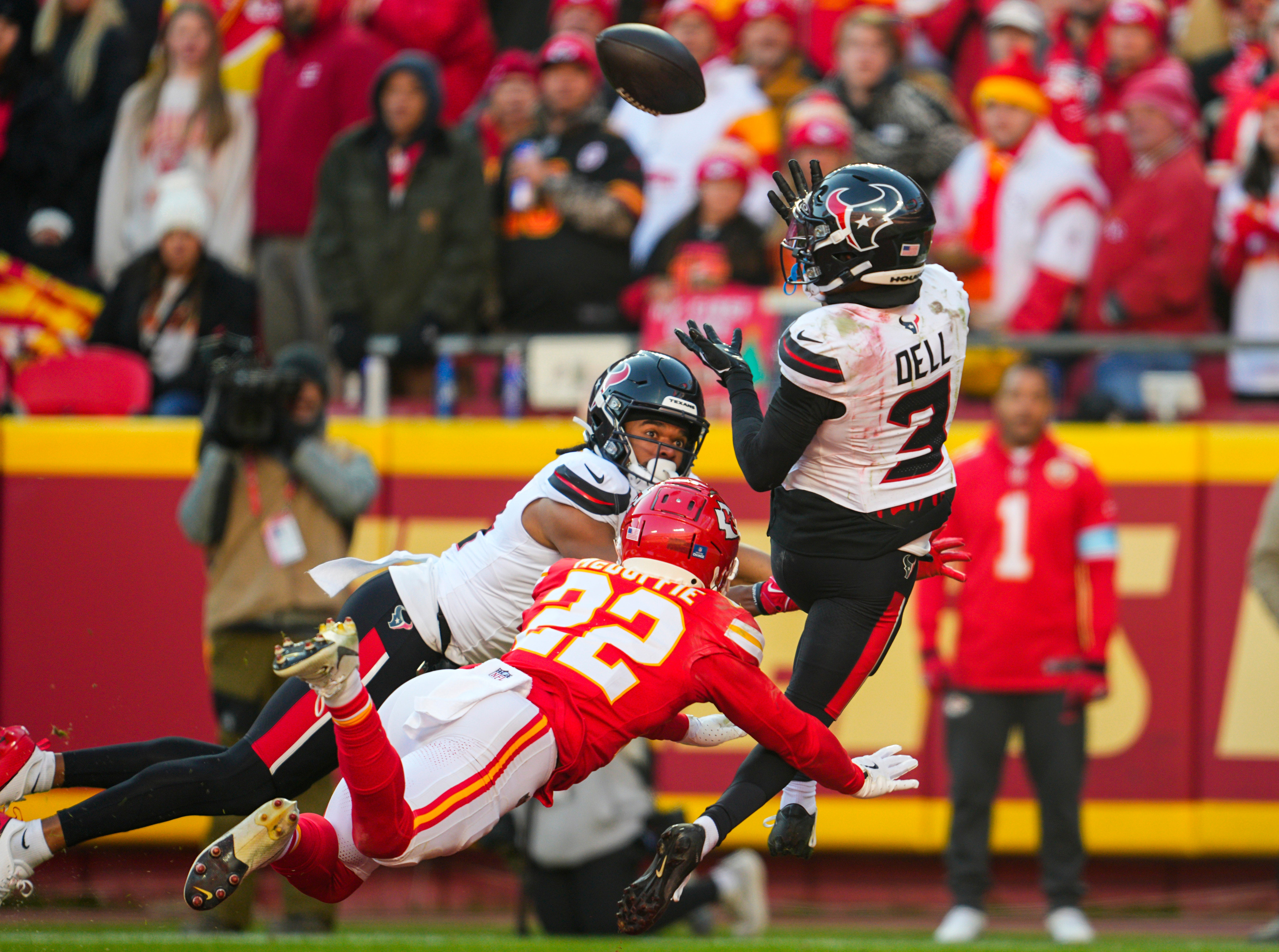 Dec 21, 2024; Kansas City, Missouri, USA; Houston Texans wide receiver Tank Dell (3) catches a touchdown pass against Kansas City Chiefs cornerback Trent McDuffie (22) during the second half at GEHA Field at Arrowhead Stadium.