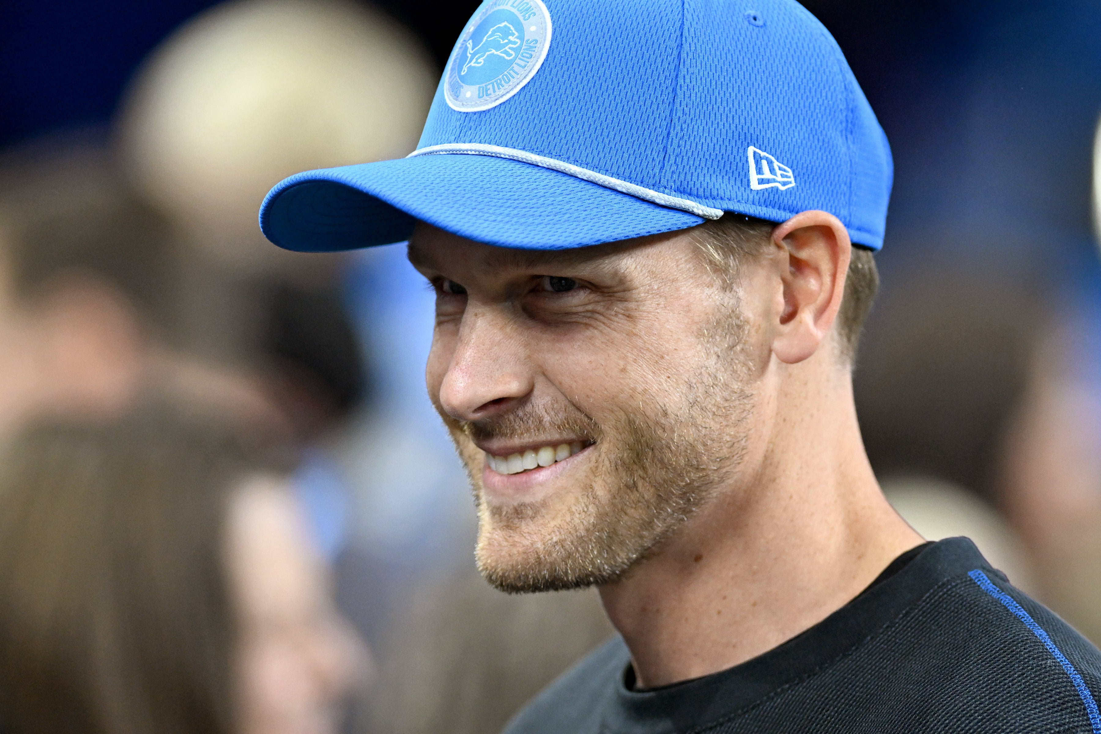 Nov 28, 2024; Detroit, Michigan, USA; Detroit Lions offensive coordinator Ben Johnson talks with fans on the sidelines during pregame warmups before their game against the Chicago Bears at Ford Field.