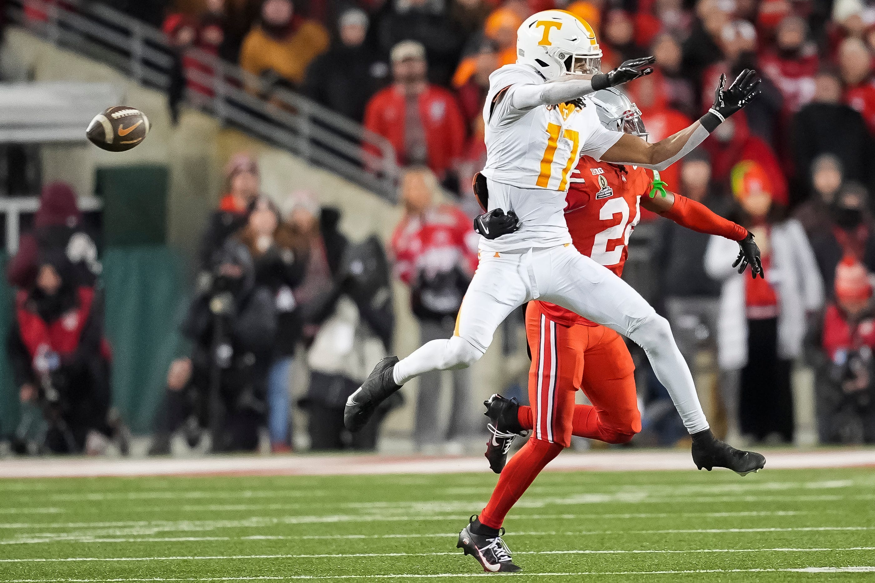Tennessee wide receiver Chris Brazzell II (17) can't bring in the catch while defended by Ohio State cornerback Jermaine Mathews Jr. (24) during a College Football Playoff first round game between Tennessee and Ohio State held at Ohio Stadium in Columbus, Ohio, on Saturday, Dec. 21, 2024.