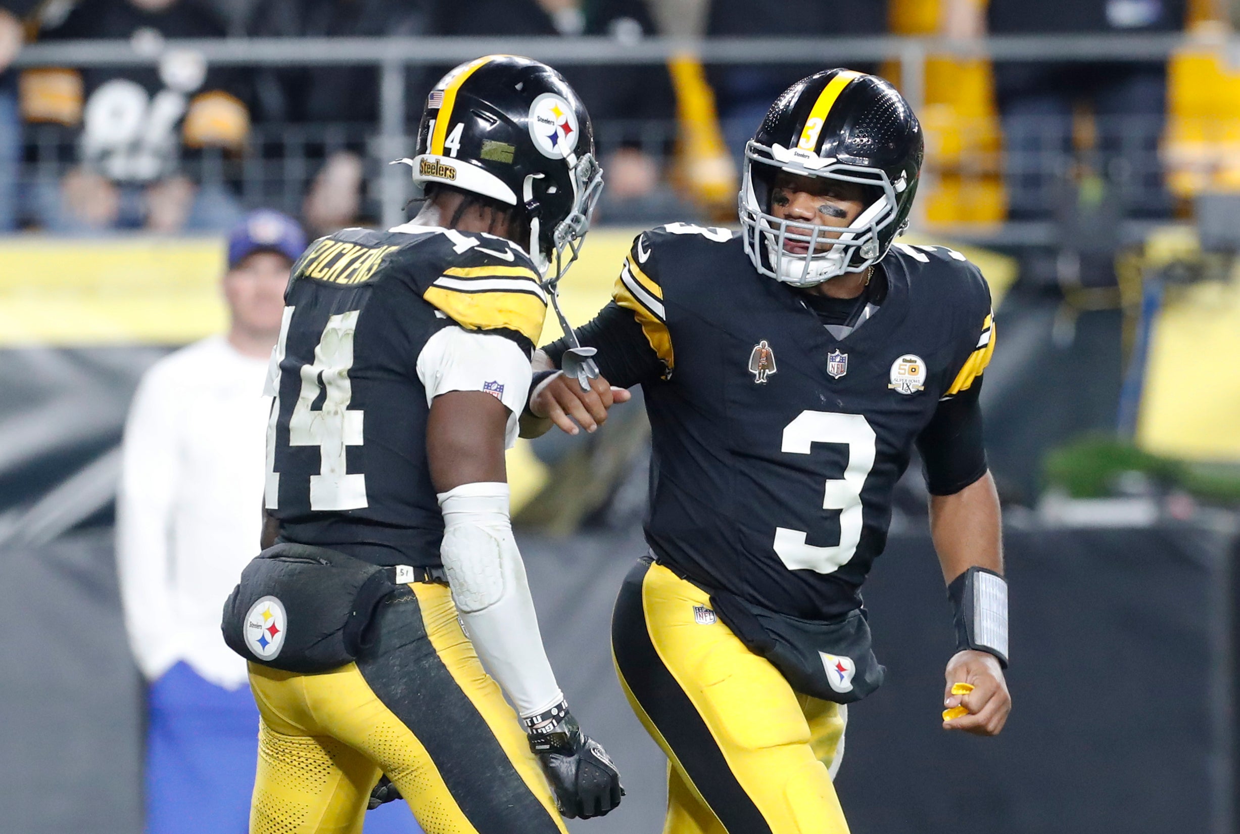 Oct 20, 2024; Pittsburgh, Pennsylvania, USA; Pittsburgh Steelers wide receiver George Pickens (14) and Pittsburgh Steelers quarterback Russell Wilson (3) celebrate after combining for a touchdown against the New York Jets during the second quarter at Acrisure Stadium. Mandatory Credit: Charles LeClaire-Imagn Images  