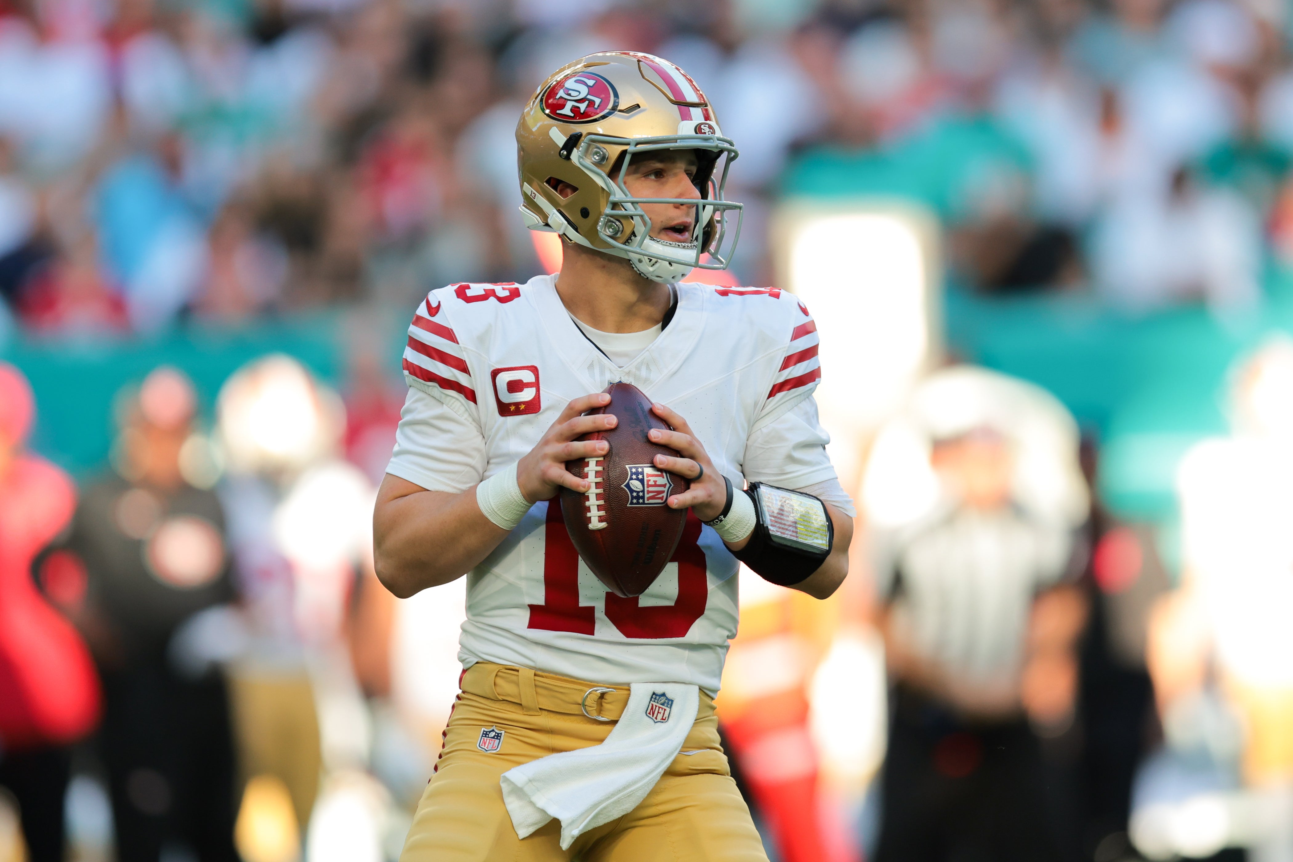 San Francisco 49ers quarterback Brock Purdy (13) looks for a passing option against the Miami Dolphins during the first quarter at Hard Rock Stadium.