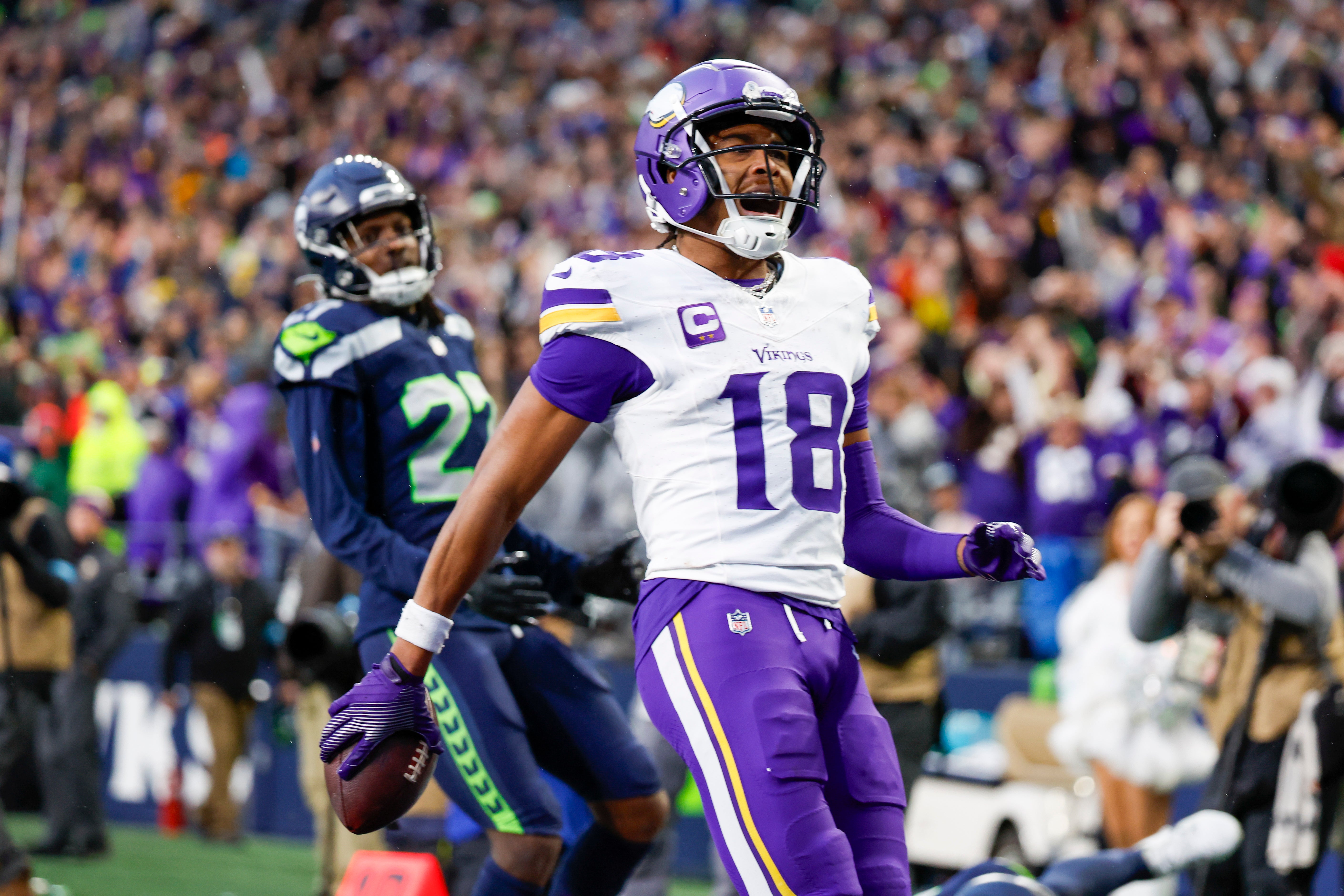 Dec 22, 2024; Seattle, Washington, USA; Minnesota Vikings wide receiver Justin Jefferson (18) celebrates after catching a touchdown pass against the Seattle Seahawks during the fourth quarter at Lumen Field.