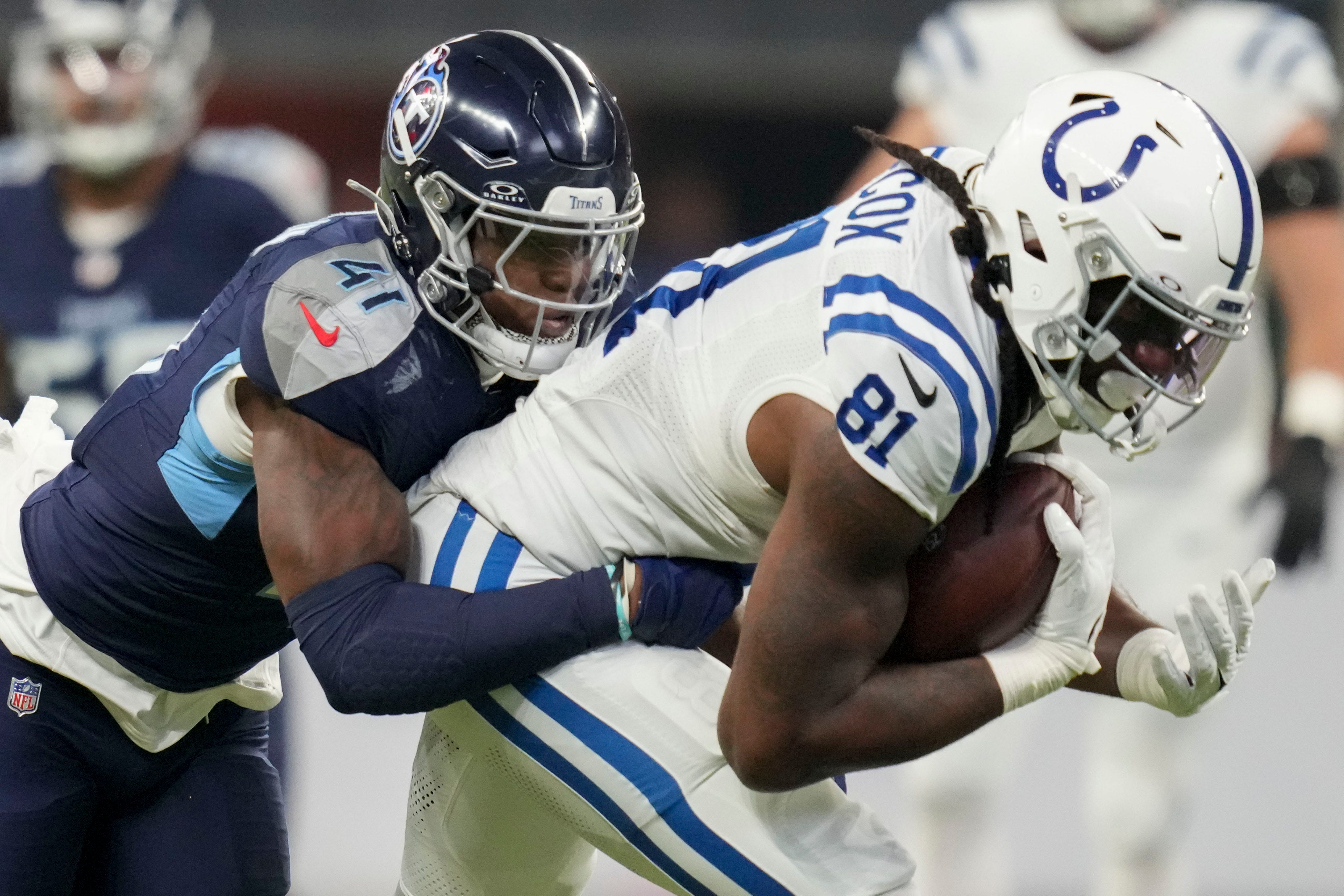 Tennessee Titans linebacker Otis Reese IV (41) tackles Indianapolis Colts tight end Mo Alie-Cox (81) on Sunday, Dec. 22, 2024, during a game against the Tennessee Titans at Lucas Oil Stadium in Indian... Christine Tannous/IndyStar-USA TODAY NETWORK via Imagn Images