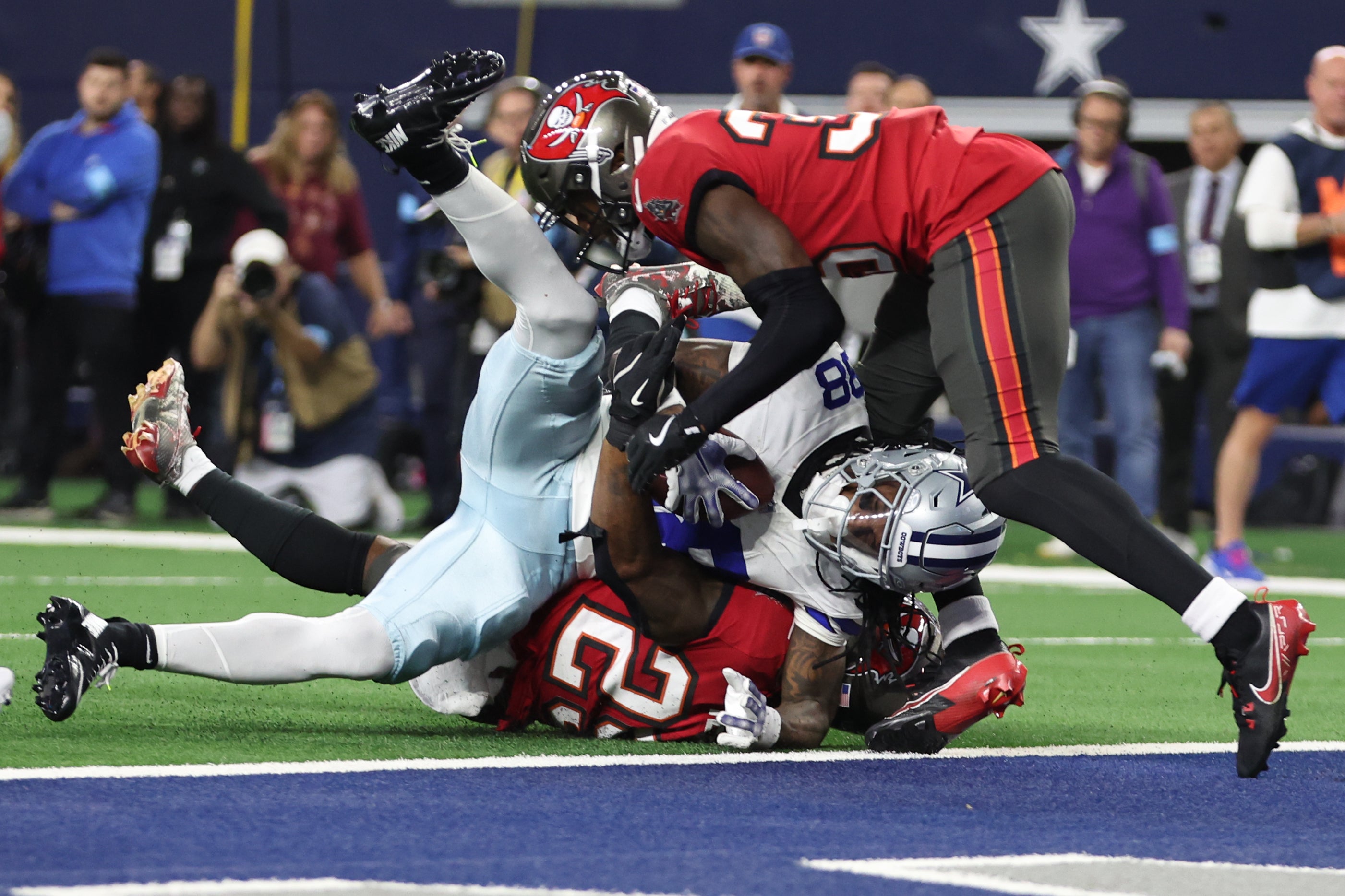 Dallas Cowboys wide receiver CeeDee Lamb (88) is tackled by Tampa Bay Buccaneers safety Christian Izien (29) in the second quarter at AT&T Stadium.