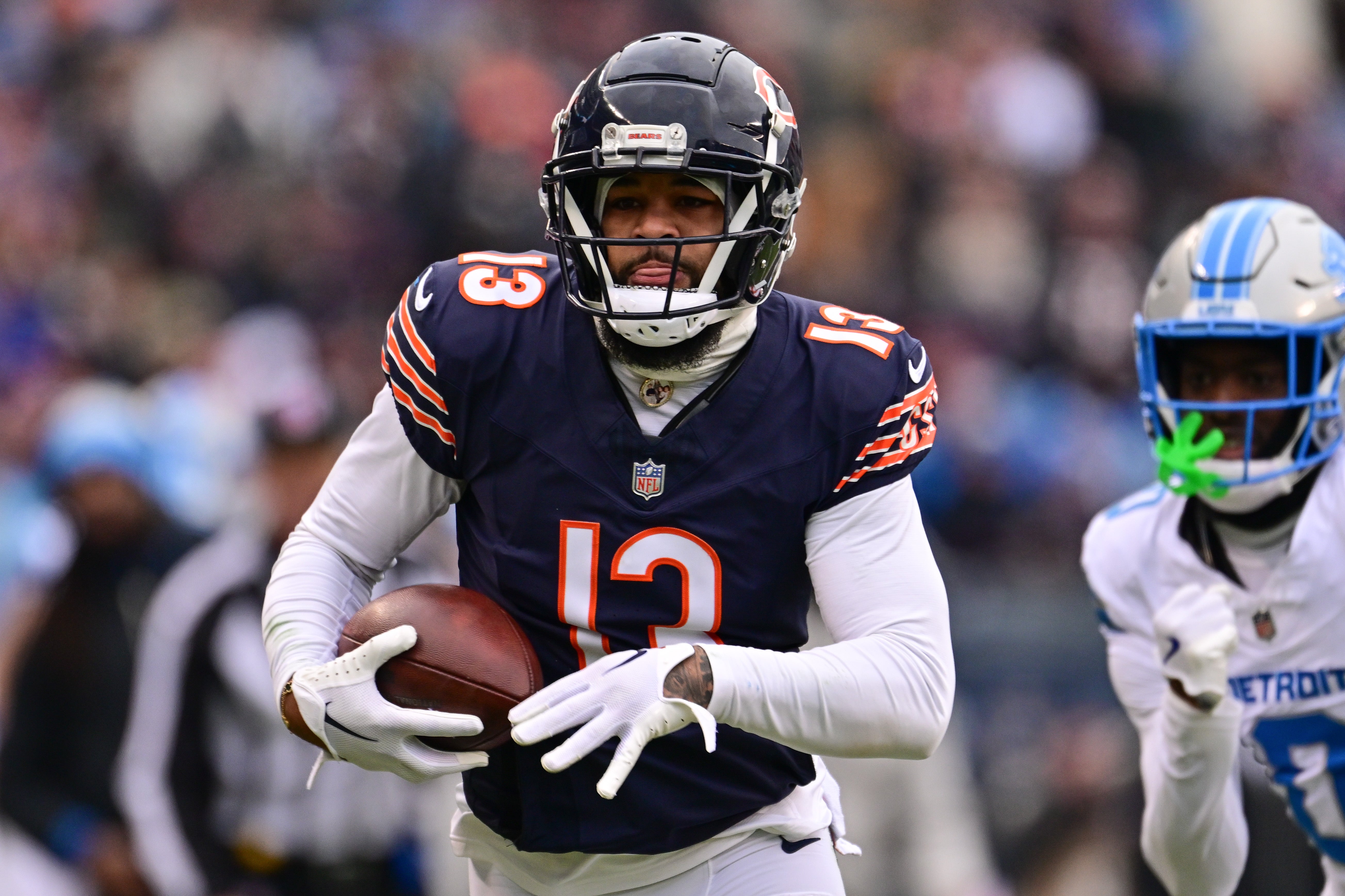 Dec 22, 2024; Chicago, Illinois, USA; Chicago Bears wide receiver Keenan Allen (13) runs after a catch against the Detroit Lions during the second quarter at Soldier Field.
